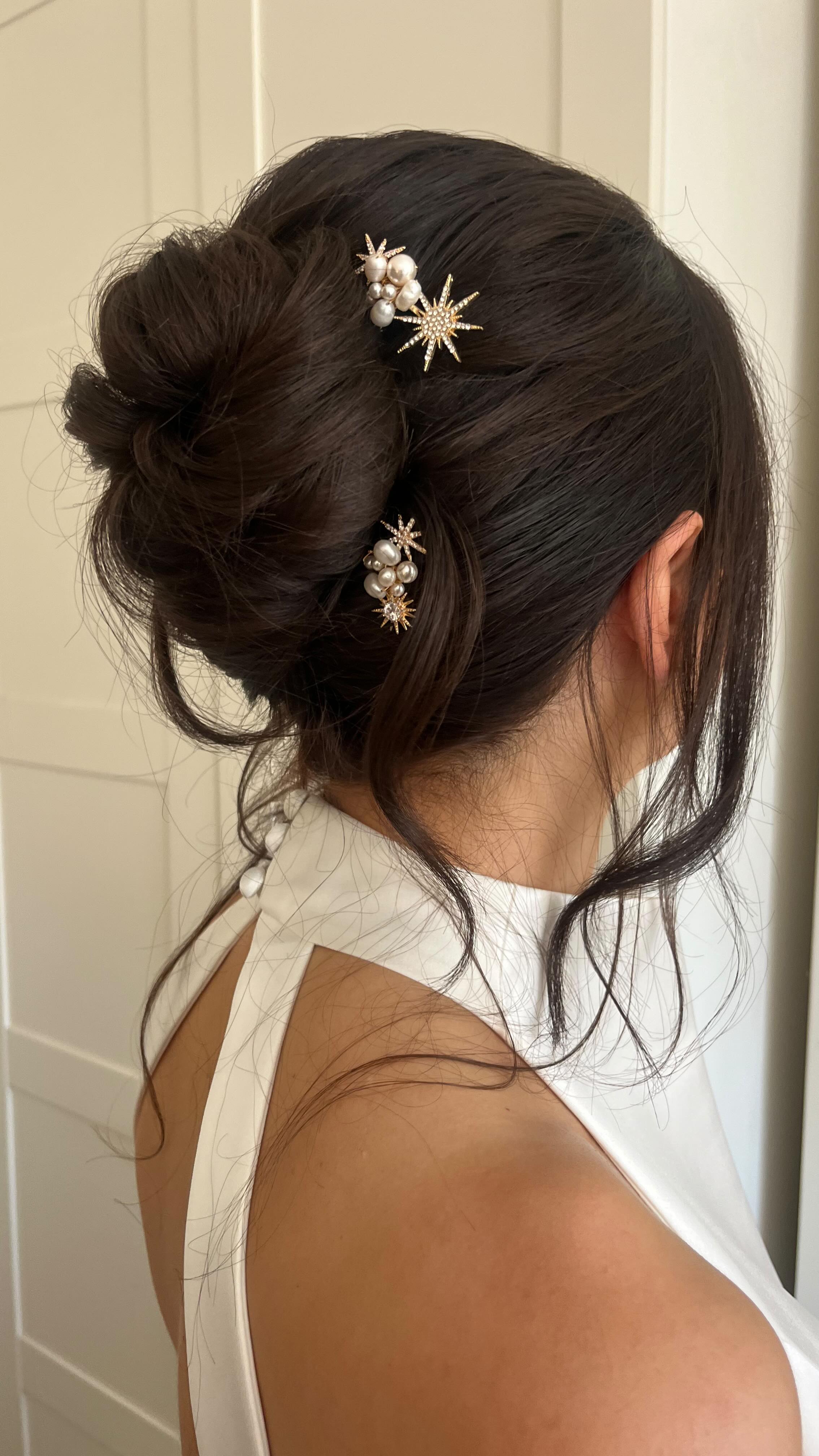 This is the most sought after bridal hair at the moment ✨
Keep reading for the products you need to recreate this, either on yourself, or for your future brides 👉🏽
1. Prep hair with @lorealpro Pli spray - this is my can’t live without product and I wouldn’t start any hair prep without it. Blowdry the hair smooth with a large round brush.
2. Use a large barrel to tong the hair, spraying each section with @hairbysammcknight Multi Task Styling Mist beforehand - this ensures the curl holds.
3. Brush out the curls then spray the whole head with @moroccanoil_uk Texture Spray - not only does it smell divine, it adds hold to the hair that we need for this style.
4. Backcomb from the top of the ears down to the nape using @kykhaircare Magic Dust Volume powder - don’t be shy with using this - you need the hold in the hair!
5. Create a French roll, then start placing the hair how it naturally twists and falls - this is where your curls come in to play. Finish off smoothing any sections with @colorwowhair One Minute Transformation.
Enjoy ✨