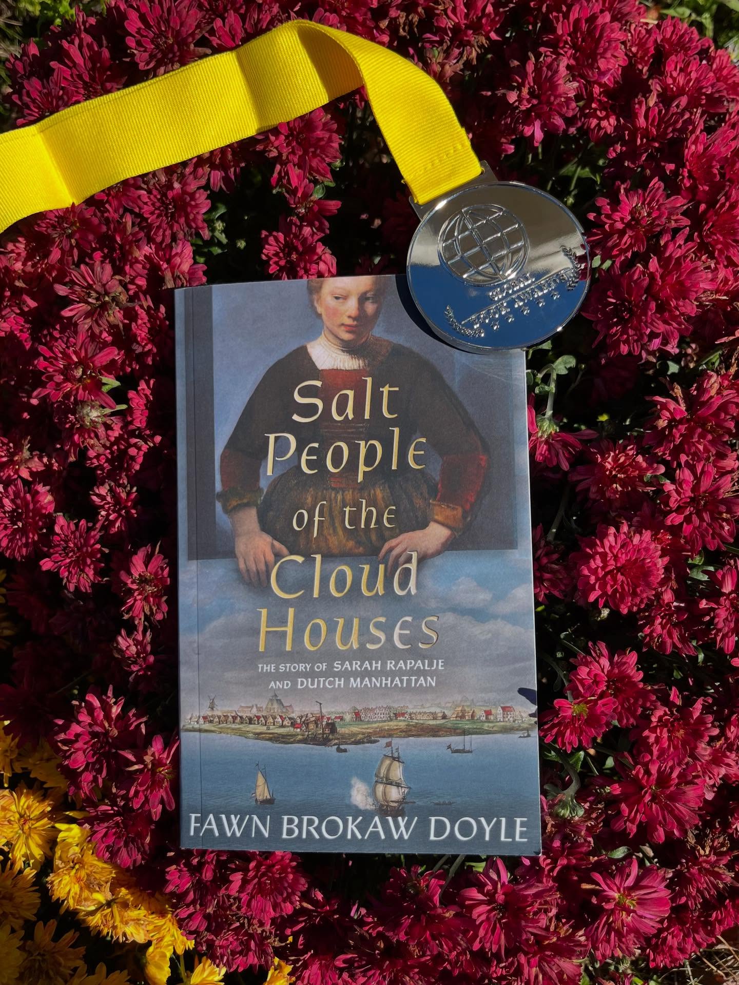 SPOTCH with her silver medal from the Global Book Awards🎉☺️
Salt People of the Cloud Houses is the story of New York before it was New York, told through the eyes of my 8th great-grandmother, Sarah Rapalje. She was the first European child born there- a Walloon in a Dutch colony. She was part of the multicultural economic hub from the start, where women had a voice and played a crucial role in its success and proliferation. Experience how Sarah and the city grew up, continually rebuilding, and ultimately enduring English conquest.