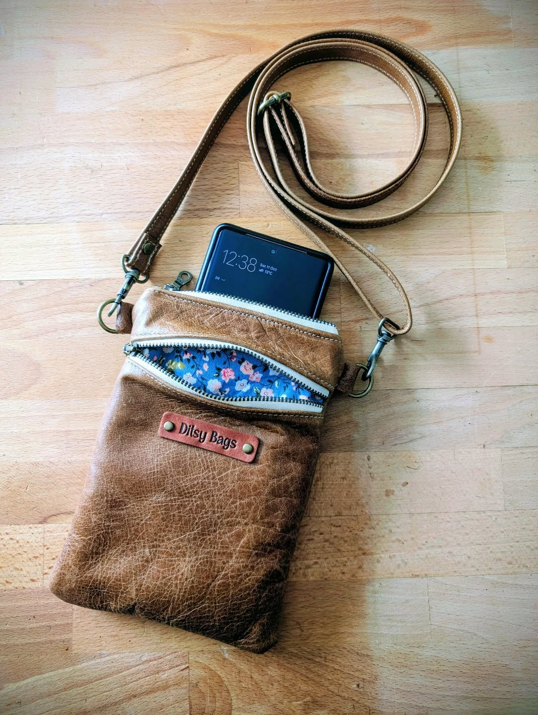 📱✨ Keep it simple, stylish, and hands-free with this handmade leather phone bag — perfect for life on the go!
Crafted from beautifully distressed leather, this small-but-mighty bag keeps your essentials close with effortless charm. 💛
⭐ Features:
• Adjustable crossbody strap for comfort and versatility
• Three handy compartments to organise your phone, cards, and keys
• Premium leather that gets better with age
• Pop of personality with a floral lining 🌸
Whether you’re exploring the city, heading to a market, or traveling light, this little bag is your new everyday essential — made with love and built to last 🤎
#HandmadeLeatherBag #PhoneBag #CrossbodyStyle #MinimalistFashion #EverydayCarry #LeatherLover #ArtisanMade #SmallBatchStyle #DitsyBags #HandcraftedAccessories