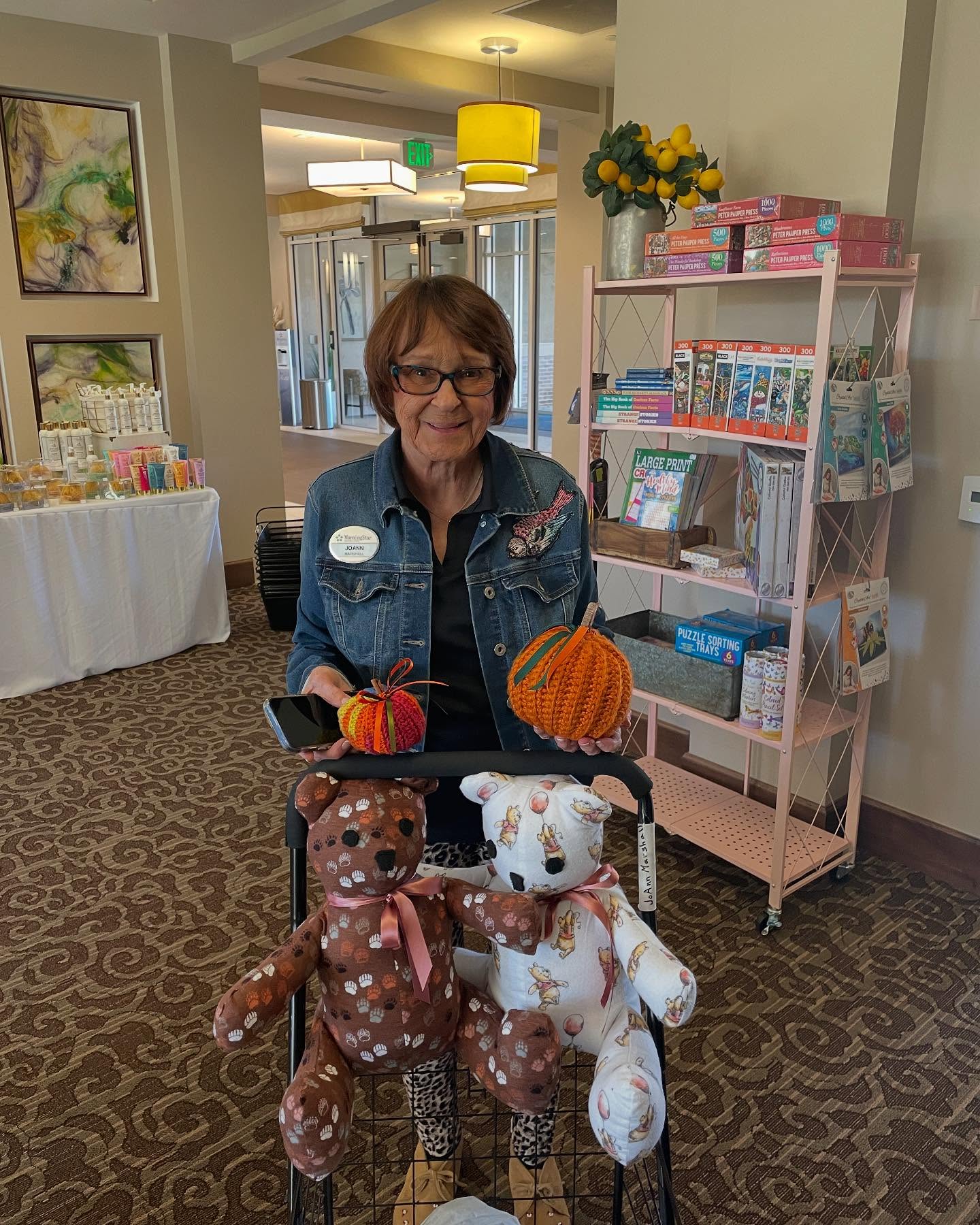 This is Joanne. Joanne started making teddy bears after her husband passed away. She brought a couple of samples down to show us. She also taught herself how to crochet these darling pumpkins. She uses cinnamon sticks as the stem. 🎃🍁🧸