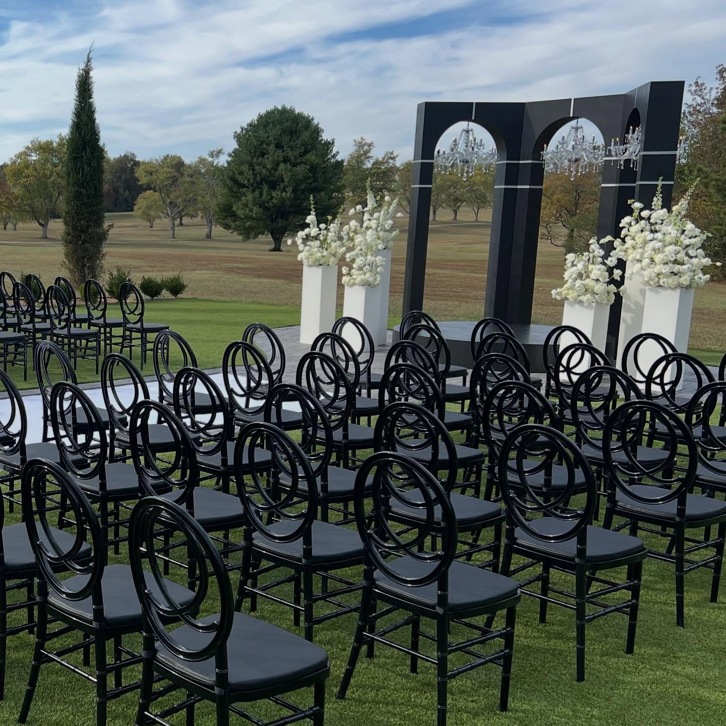 Our black Phoenix chairs are a great addition to a ceremony setup. #luxurychairrentals #eventrentalsatlanta #partyrentalsatlanta #georgiapartyrentals #luxuryweddings #luxuryweddingplanner