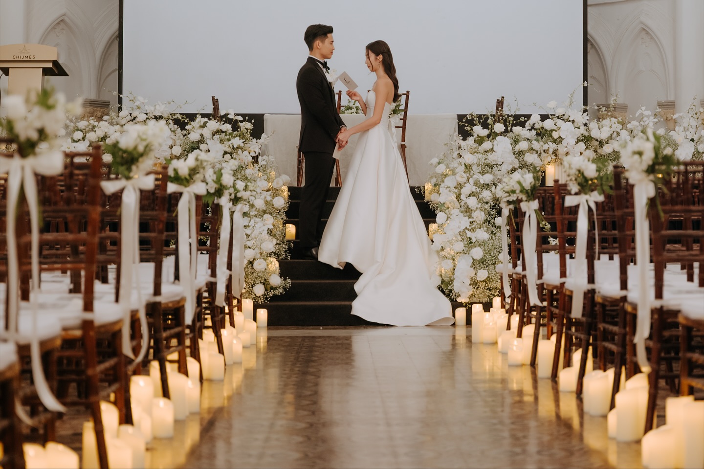With Immanuel & Tricia 🤍 their dedication to each other and their journey from when they met up till today (enjoying their time in Australia) is a heartwarming and touching one. Lots of love from us to you both @immanky @tee.jungg
Planner & coordinator: @thegenuinevows
Photography: @wanderlustdreamco
Videography: @thegoodside.sg
HMUA: @autelier_makeup @rowan_autelier
Bridal gown: @theivorybridal
Flowers: @floralsbyfel
Venue stylist: @victoriaweddingcollection
Venue florist: @aflowerinvite
Live feed: @eaglelasticweddings
Venue: @chijmes_hall
Wedding reception: @thewinerysg