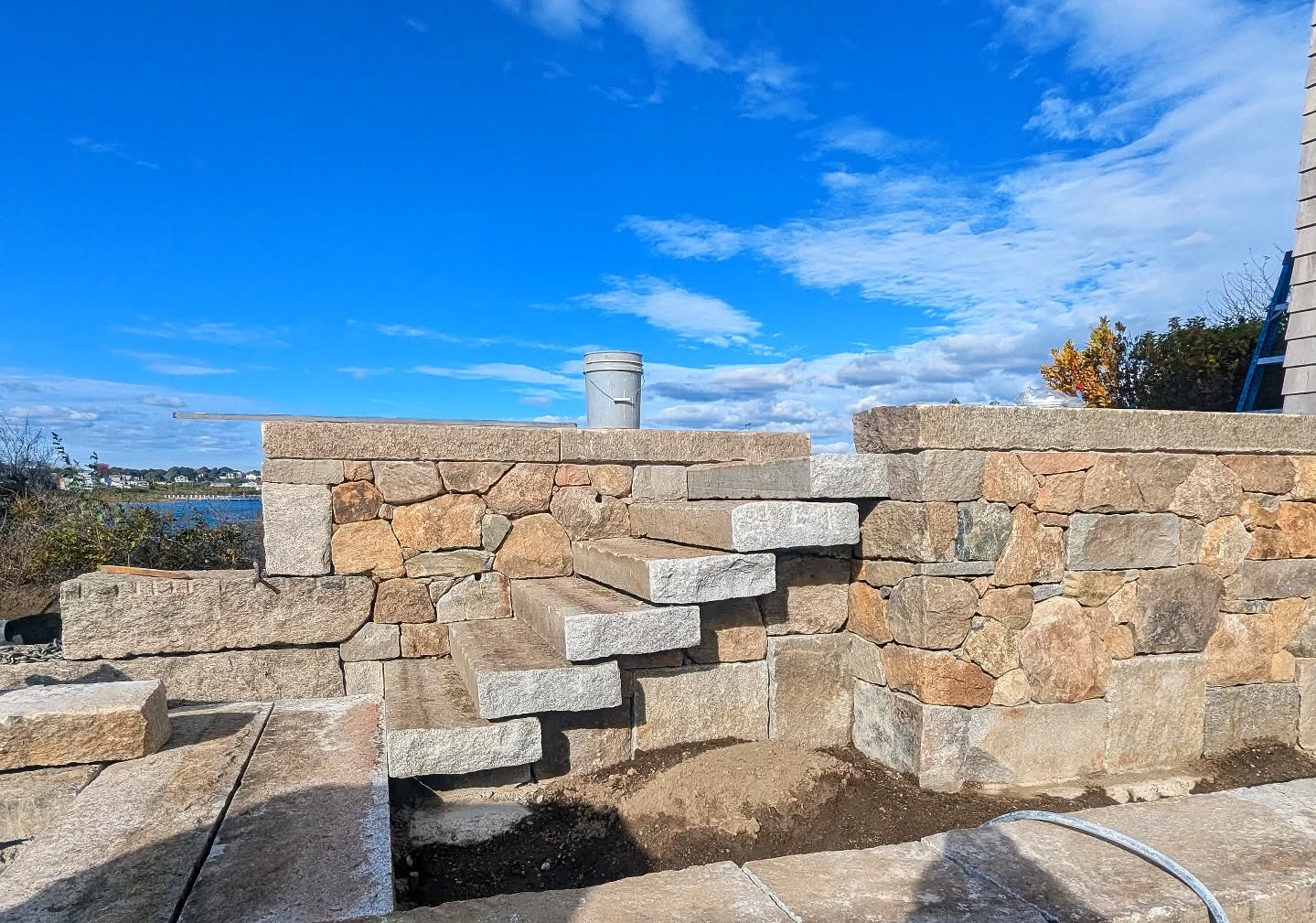 Under construction at our #HighPoint project: Progress is moving right along at our retaining wall/cantilever step combo - now with a finished landing at the top, and granite bands outlining a parking court at the bottom.
Architect: @whittenarchitects
Landscape Architect: @triplettdesignstudio
Landscape Installation: @landscapecreationsri
GC: @granville_builders
#triplettdesignstudio #landscape #landscapedesign #landscapearchitecture #landscapelovers #residential #residentialgarden #residentialdesign #newengland #design #designer #senseofplace #coastallandscapedesign #masonry #stonemasonry #stonework #bridgeblock #granite #hardscape #retainingwall #cantileversteps #outdoorsteps #rilandscapedesign #rilandscapearchitecture #rhodeislandlandscapes #rhodeislanddesign #southkingstownri #pointjudithpond