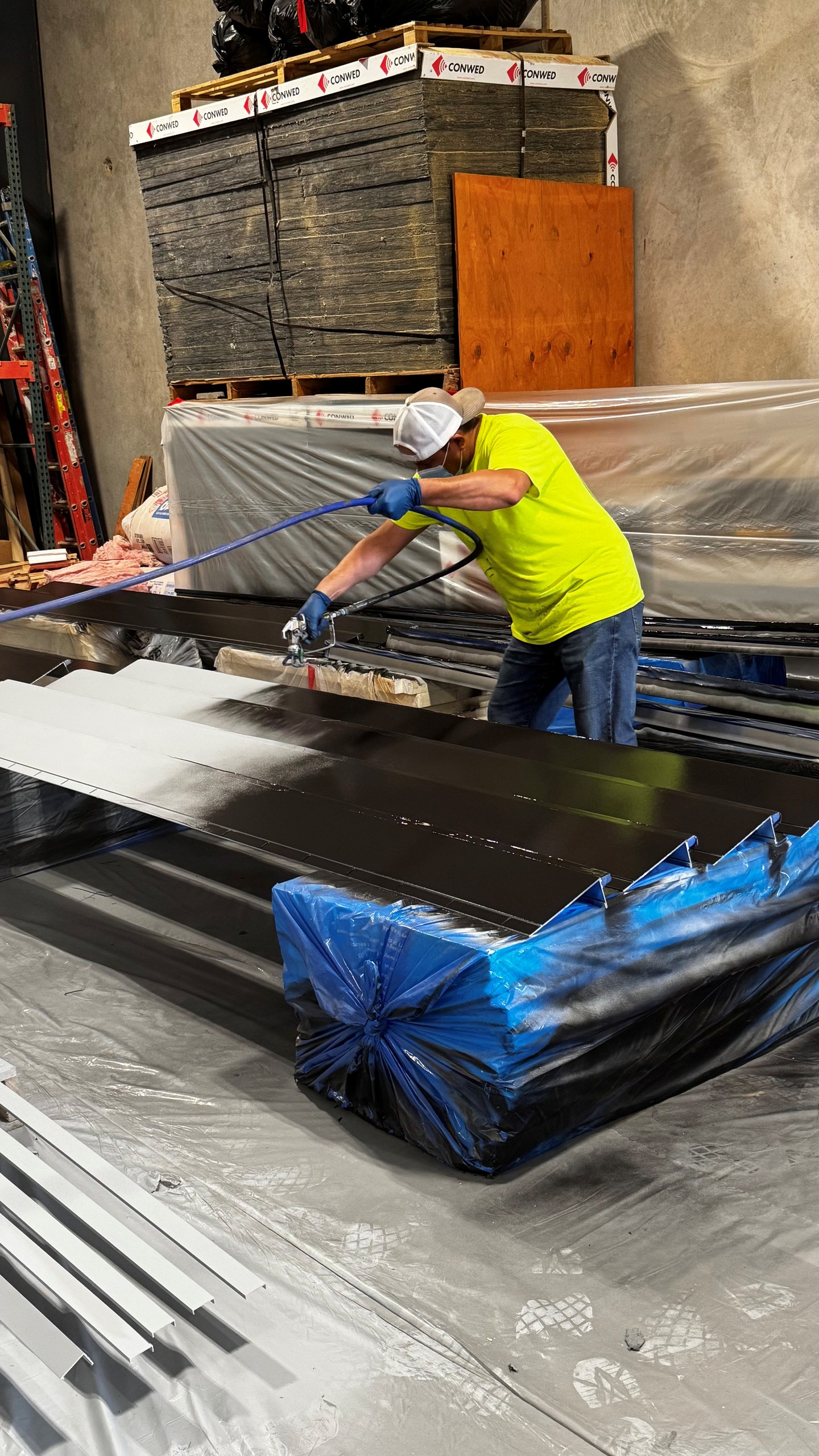 Armstrong Axiom trim is being painted black in our warehouse for the new LifeChurch YouVersion Building.
On Time & On Budget
Green Country Interiors