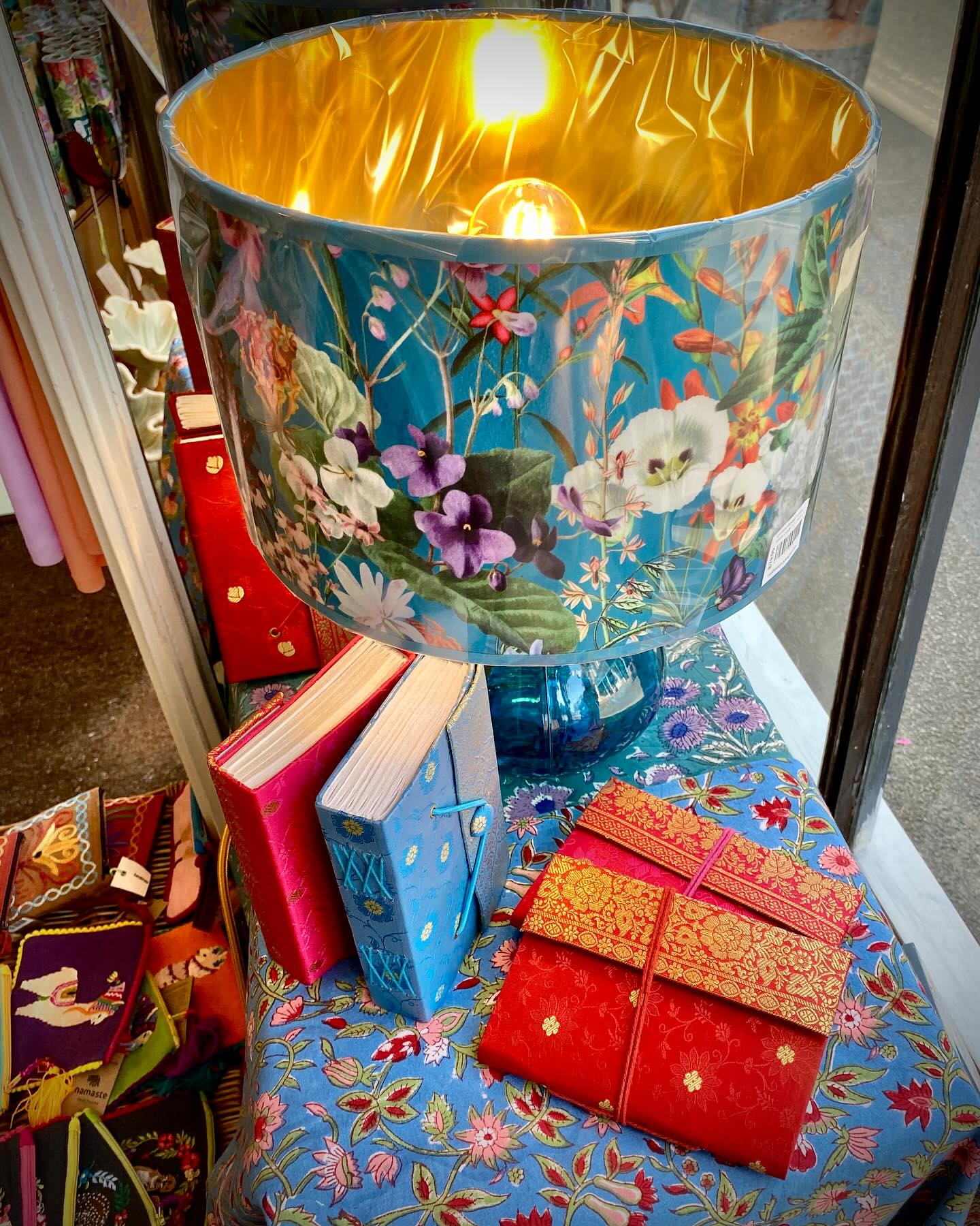 Just One Pair Left!
These sumptuous handmade limited edition velvet lampshades are almost sold out, but we have two left in stock.
The opaque fabric and brilliant gold lining create a lovely ambient glow for any space where subdued lighting is desired.
Drop us a message for further details or call in to the shop.
Also featured here:
Fair trade journals and notebooks made with sari fabric in Rajasthan and a backdrop of our classic Indian hand block-printed tablecloths.
Swift Art & Design
18 High Street
Winchcombe
GL54 5LJ
Open:
Tuesday - Saturday
10am - 4pm
#swiftwinchcombe #swiftcotswolds #shopsmall #shophandmade #shopindependent #supportindependent #swiftartanddesign
#winchcombeshopping #winchcombe #visitwinchcombe #winchcombecotswolds