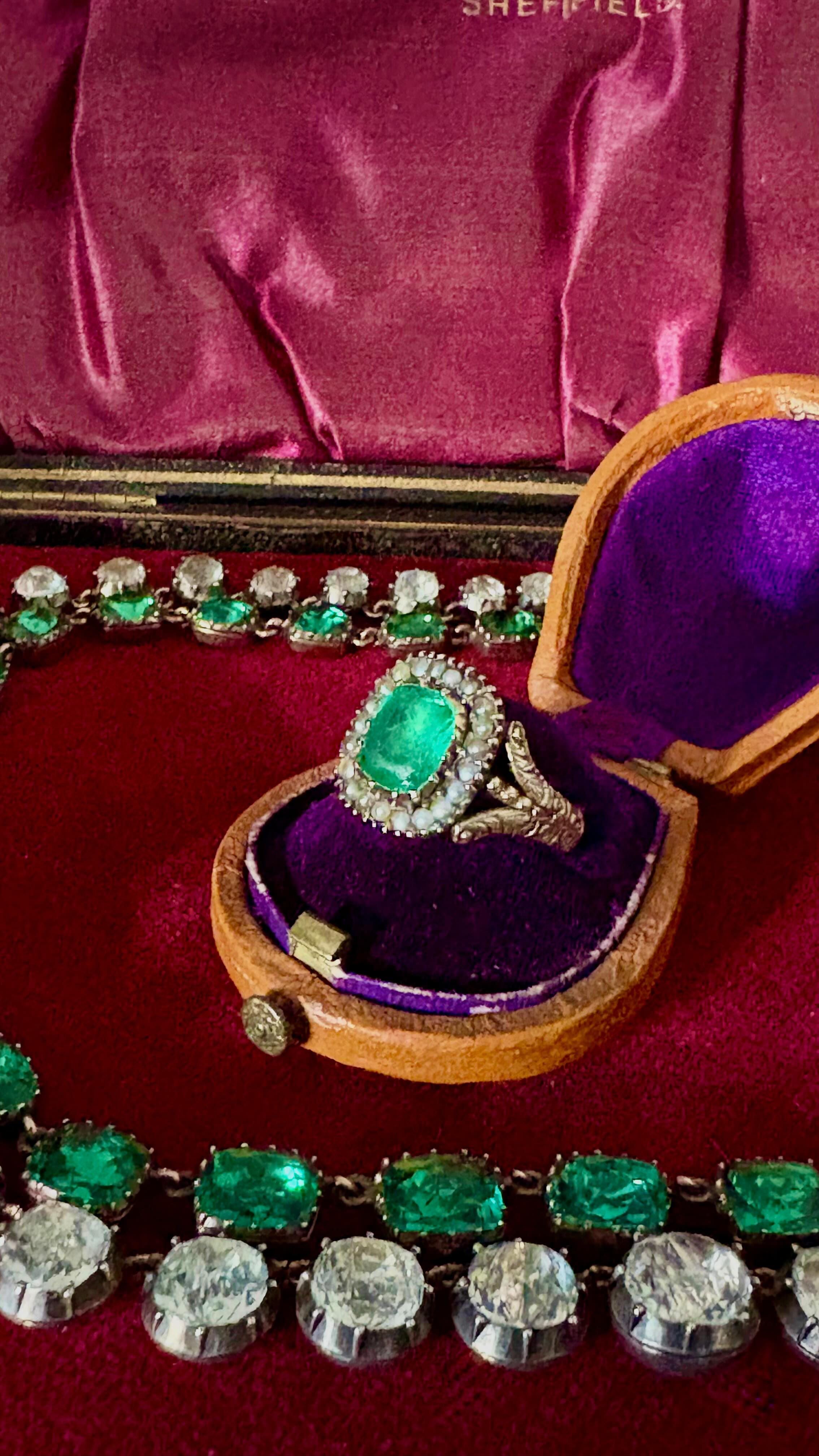Georgian Emerald Paste Ring with Seed Pearl halo. Sits beautifully low on the finger. Absolute dream antique ring c1820. Available at www.heirloomjewells.com