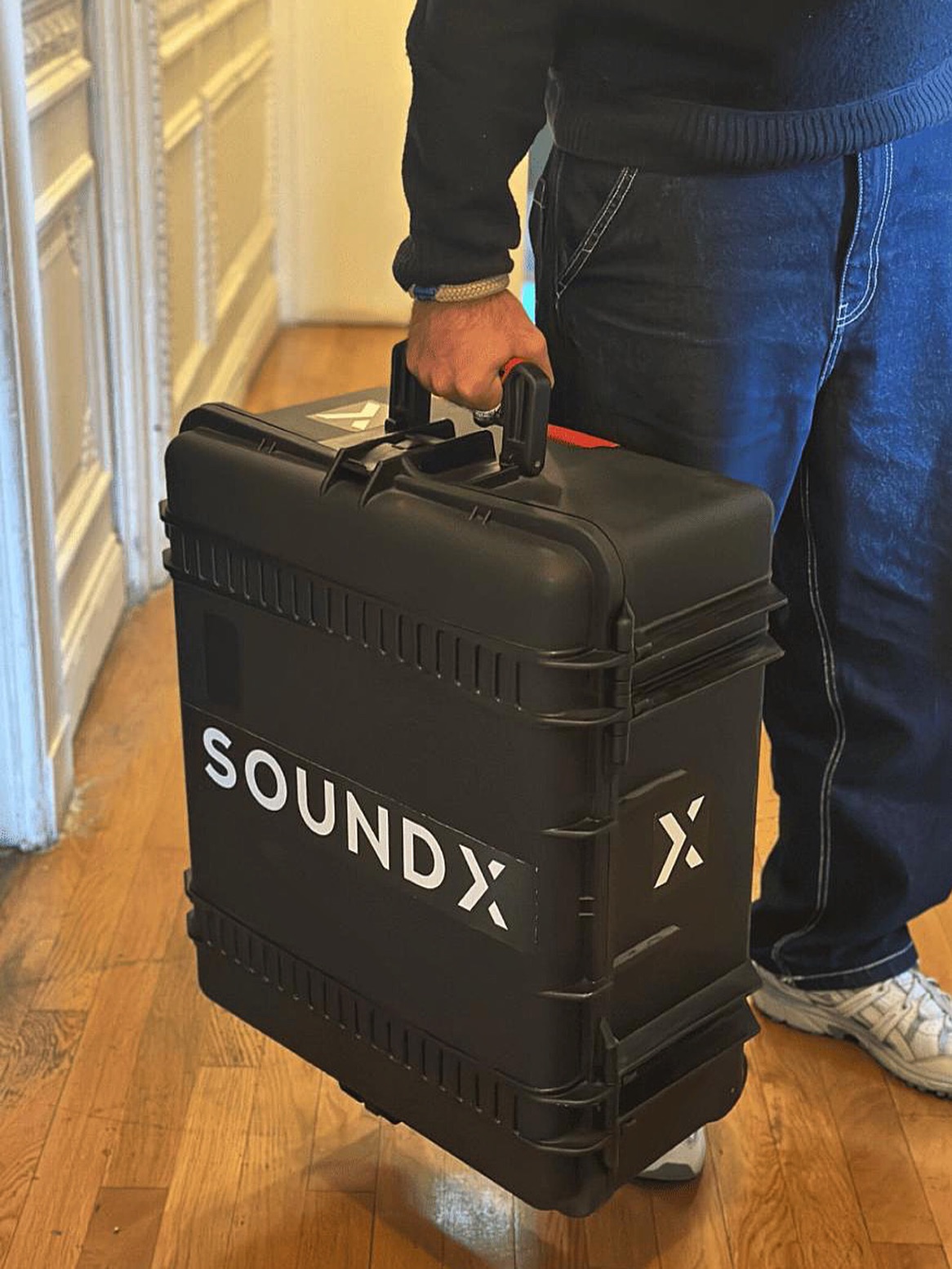 While some are winding down, festival season continues for us.
Stay tuned. 👀✨
#SoundX #AccessibleEvents #InclusionMatters #NextChapter
Image description:
A person wearing a dark sweater and jeans is holding a large black hard case labeled “SOUNDX” in white letters. The case, lifted slightly off the wooden floor, has sturdy edges and wheels. The scene takes place in a hallway with white walls and light wooden flooring.