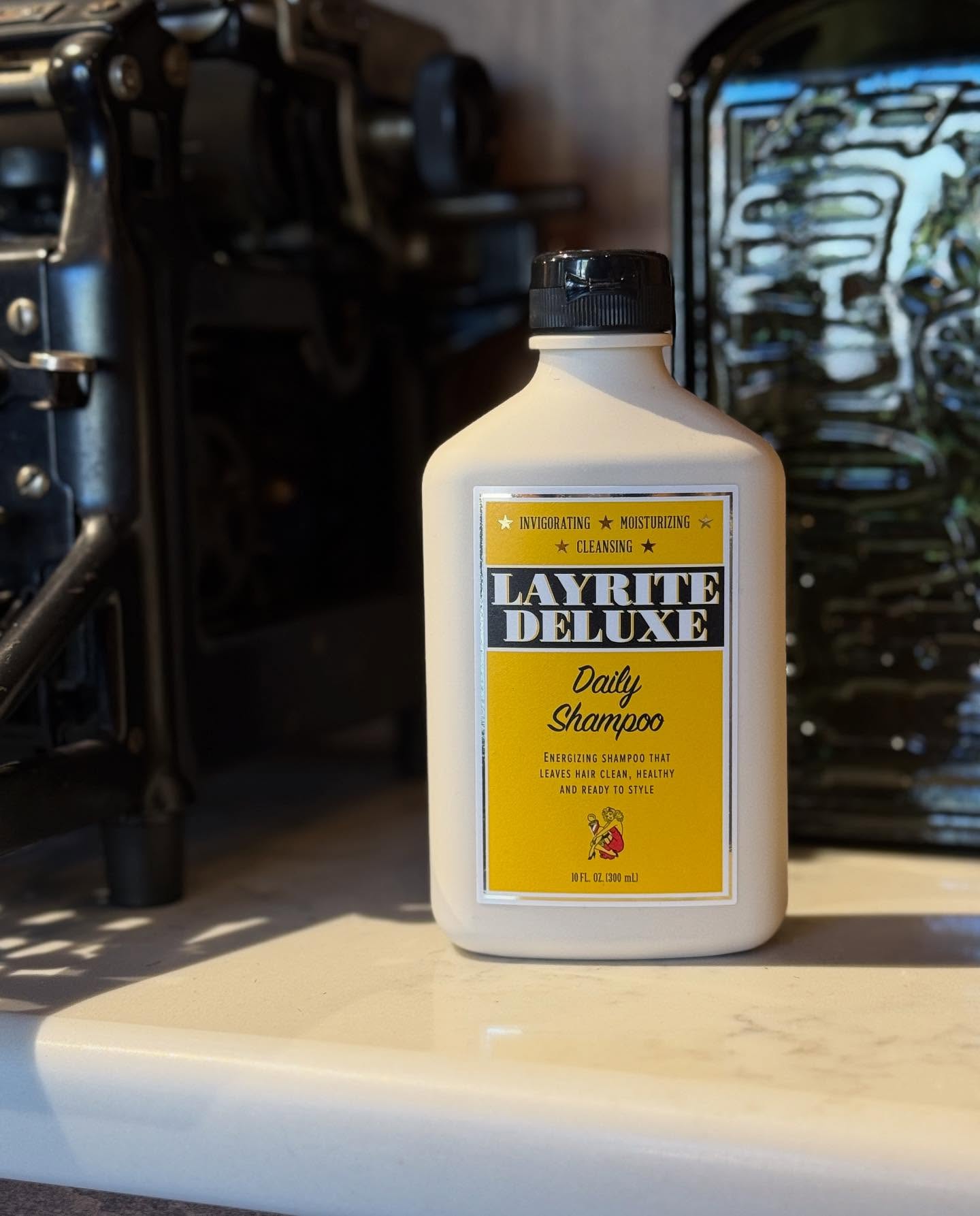 Layrite Deluxe Shampoo deeply cleanses build up and invigorates your scalp, while keeping your hair soft and ready to be styled. Our go-to shampoo in the shop, and you can bring it home! Find it in our apothecary section.