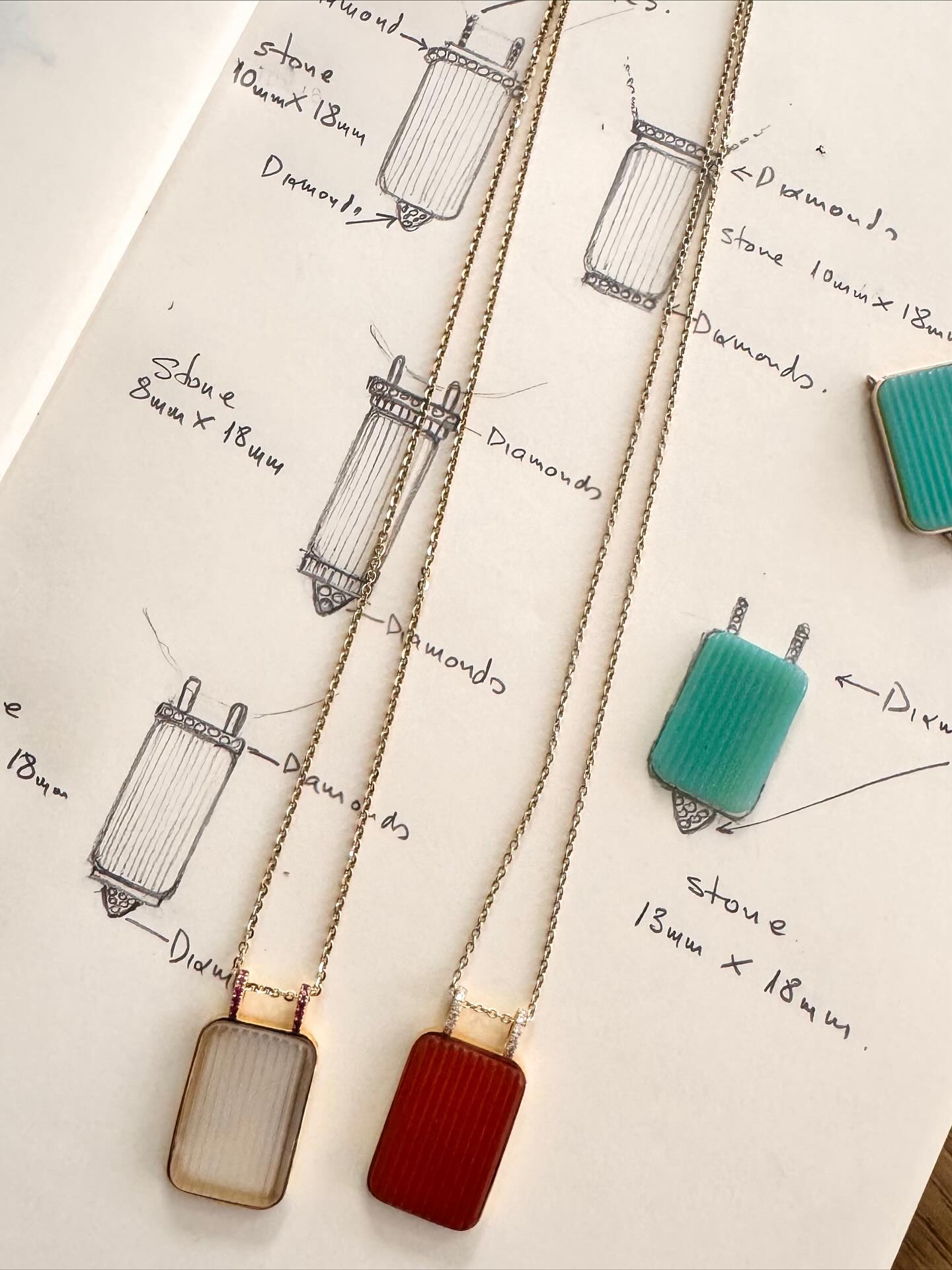 Every piece begins with a sketch ✏️ where imagination meets craftsmanship. ✨ Our colorful Kion Pendants Collection comes to life with carved lines on stone. #fotinipsarouli #handmadejewelry #finejewelry #process #sketches