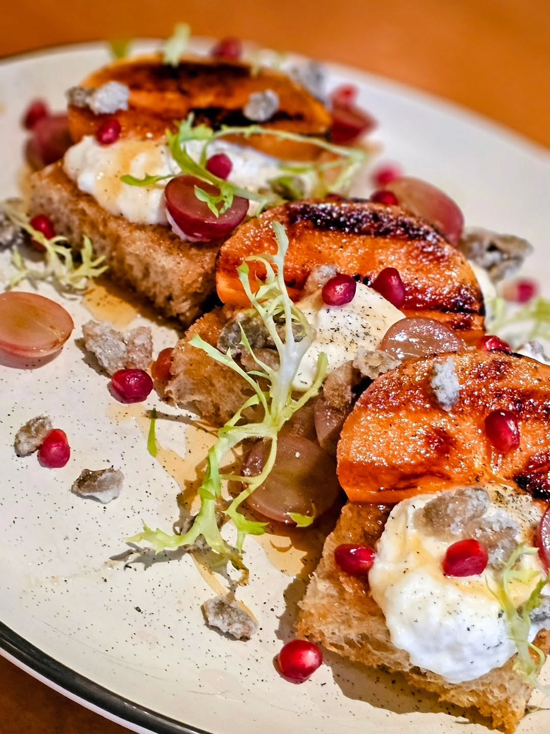 Persimmon & Burrata Bruschetta
brown butter brioche/burrata/grilled persimmon/katz black button sage honey/hawaiian lava salt/candied pepitas/pomegranate/pickled grapes
#ChefLife #ChefsOfInstagram #FoodStyling #CulinaryArt #PlatingGoals #InstaChef #CreativeCuisine #TastingMenuVibes #FromTheKitchen #ArtOfFood #Persimmons #BurrataLove #AutumnProduce #EatSeasonal #HarvestSeason #FallHarvest #GourmetInspo #LocalIngredients #FoodPorn #BeautifulBites #BrunchGoals #EdibleArt #FoodPhotography #RusticElegance #SlowFoodMovement #FeastForTheEyes #SeasonalSimplicity #ChefTable