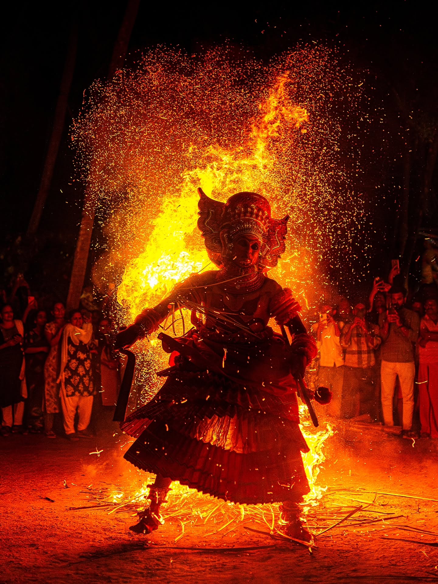 Theyyam a traditional ritual art form of North Kerala depicts divine beings through dance music and fire In this performance the artist embodies the fierce and powerful form of Kanadar Kelan symbolizing protection and divine energy Surrounded by flames and rhythmic chants the performer moves with intensity and devotion creating a mesmerizing connection between the human and the divine This moment captures the spiritual essence and cultural richness of Theyyam where falth and artistry merge into a living flame of tradition 🔥🔥
Shot on @nikonindiaofficial z6 with @sigmaphotoindia 35mm 1.4 DG DN
#theyyam #theyyamfestival #keralafolkart #indtanculture #keralaculture #indianheritage #folklore #indiaphotography #documentaryphotography
#culturalphotography #portraitphotography #travelindia #indianfestivals #ncredibleindia #heritageindia #indiaphotostory #nikonindia #nikonz6 #sigma35mm #vedaantkulkarnidv #natgeoyourshot
#natgeoindia @natgeoindia
(Theyyam,Kerala rituals, divine folklore, traditional art, cultural documentation,Indian heritage, fre and faith, storytlling portraits, travel and culture, gods of Kerala)