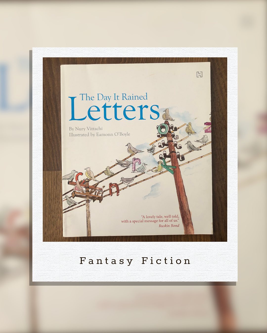 The Day it rained Letters
By Nuri Vittachi
For a reader, this is a story set in a dystopian world where books don’t exist. The written word has disappeared, and with it, people’s imagination. There’s no story time in schools, no bedtime tales, and libraries stand with rows and rows of empty shelves- only wise old men sitting there with information in their minds but none in print.
Amidst all this, Minky Binka chances upon some odd shapes falling from the sky. These shapes turn out to be letters- tiny building blocks that could one day make a book.
It’s quite a telling tale of where we seem to be heading. The overwhelming presence of the digital world replacing every form of reading is already underway, and this story captures that reality so well.
We loved how the story was set up and where it led. Getting the lone printing press up and running was truly thrilling to read. We loved the premise- it’s imaginative, hopeful, and thought-provoking. It’s quite long for a picture book, and perhaps better suited for older children, especially since the story itself calls for a little more understanding.
Ideal for kids aged 7+ yrs