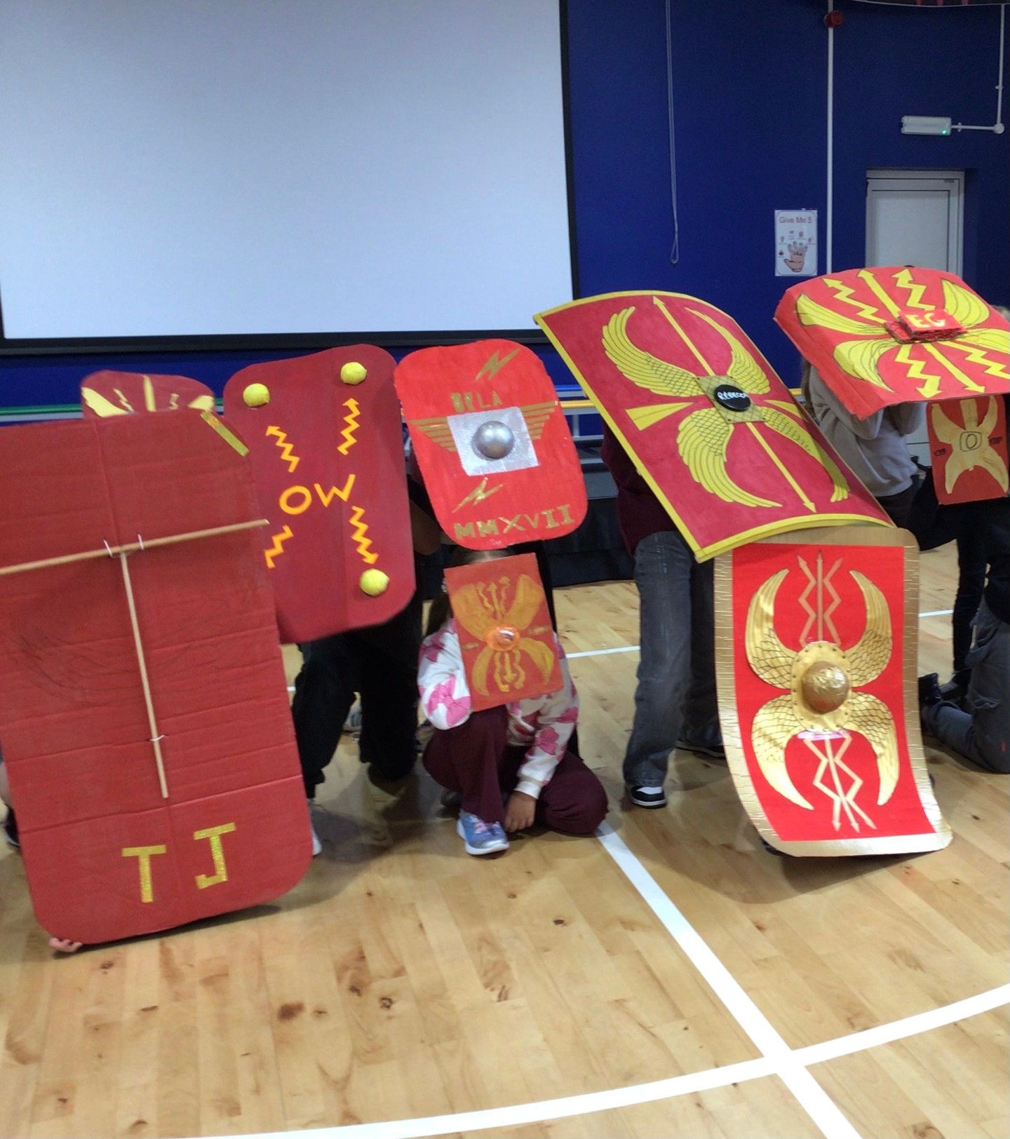 In Year 4, our budding historians have been exploring the fascinating world of the Romans! Each student designed their very own Roman shield, showcasing their creativity and understanding of this iconic symbol of Roman culture. After drawing and designing, the children made their shield at home and brought them into school.
Children in Year 4 have been exploring Roman history by designing their very own Roman shields! They then crafted these amazing creations at home, showcasing their creativity and learning. Check out their fantastic work! #RomanHistory #CreativeLearning #EducationMatters #Year4Achievements