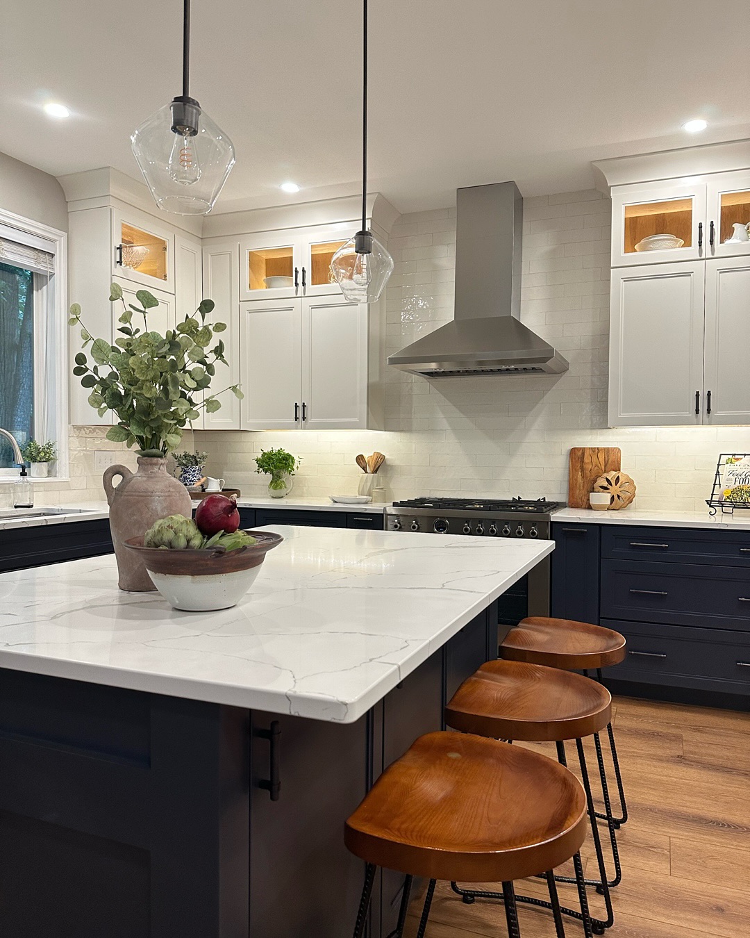 From Builder-Basic to Bold & Beautiful ✨
Every home has a story to tell — this kitchen’s just needed a little rewriting. What was once dark and cookie-cutter is now light-filled, timeless, and made for connection.
We reimagined the layout to create better flow around the new island and cooktop — small adjustments that made a big difference in how the space feels and functions. Out went the dated cabinetry, and in came a duo of fresh tones: a grounding navy for the base cabinets and a crisp white above to lift and open the room.
White quartz countertops with soft, warm veining and an artisanal style tile backsplash add texture and light, while bronze hardware and lighting bring that perfect touch of modern rustic edge.
The result? A kitchen that feels elegant yet effortless — the kind of place where life naturally happens.
Contractor: @timberwolfconstructionalaska
Countertops: @granitecityalaska
#KitchenDesign #InteriorDesigner #BeforeAndAfter #KitchenRemodel #HomeInspiration #DesignDetails #TimelessDesign #ModernClassic #InteriorsThatInspire #alaskahome #alaskainteriordedigner