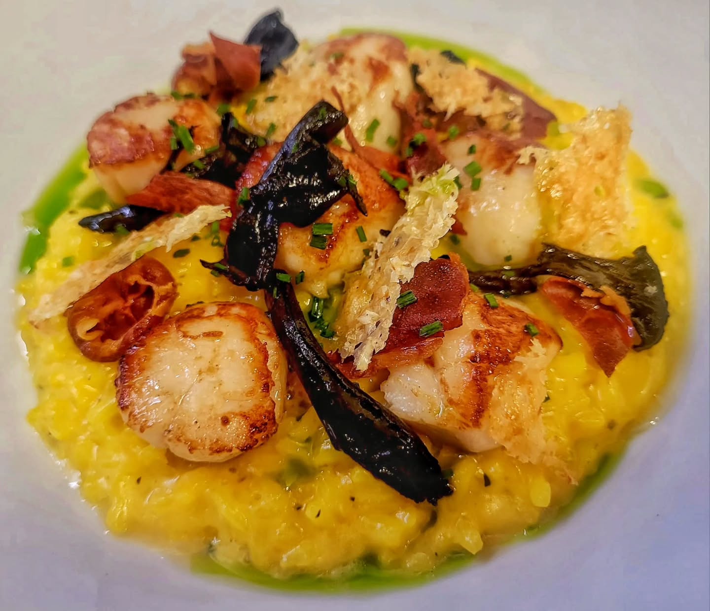 Tonight's market fish
Seared Brixham scallops, saffron risotto, crispy prosciutto, trompet mushrooms, chive oil