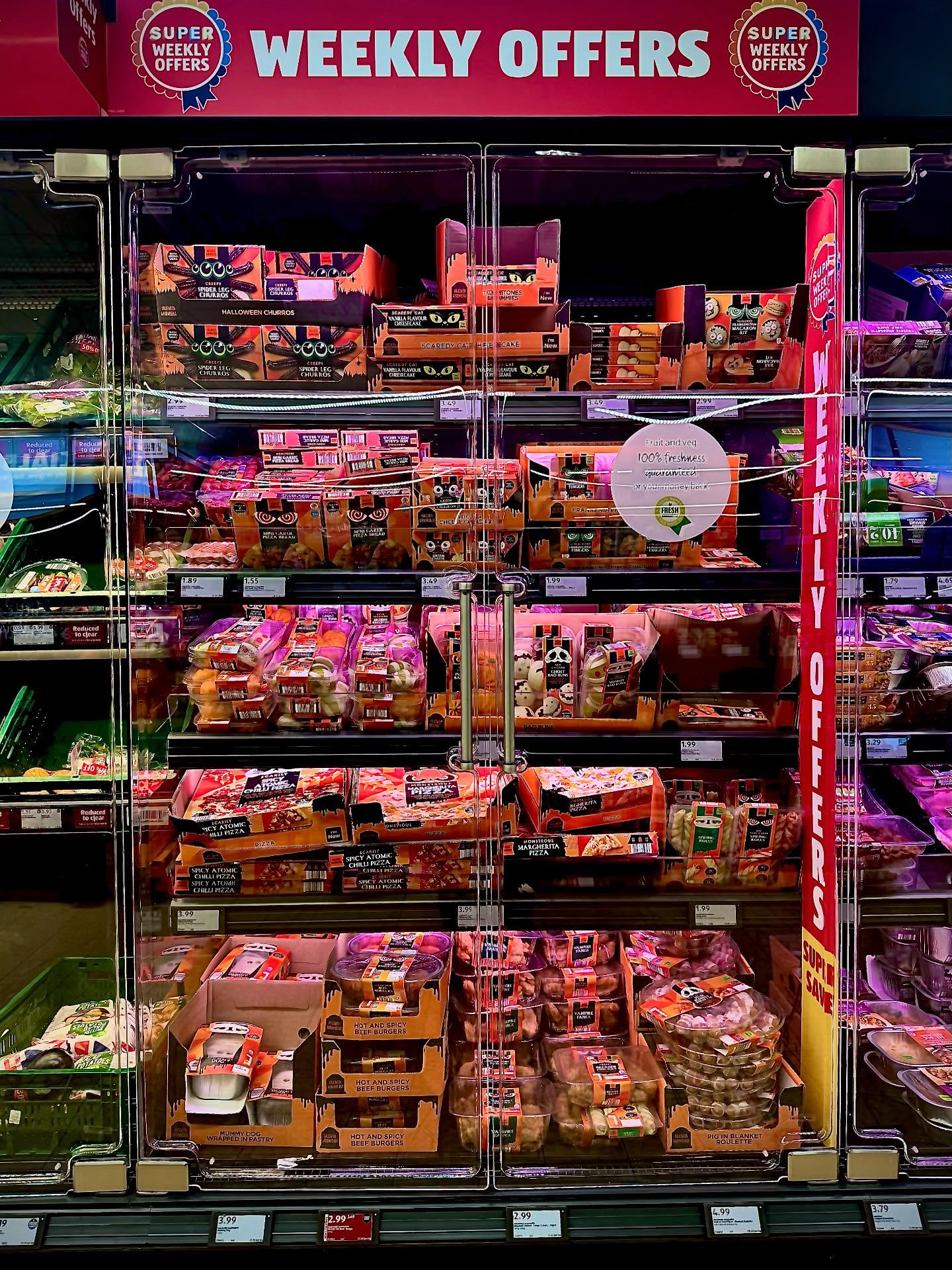 Uk has gone pumpkin mad . The food designed for one night as well as being international. I took photos of Aldi’s fridge full of “Halloween Foods “ crazy ? But a selection of snacks from around the word spring rolls through to the pork buns decorated “ Cranston sausages mummy boa buns monstrous pizza’s ghost nap buns . That’s not counting the specially designed sweets and candies they even call some lollies . Windows are draped with Halloween stuff , cut out bats , that appalling fairy floss that destroys wildlife and ends up everywhere and pumpkin motive . The pumpkins drive me insane . My Scottish heritage showed up on Halloween as I grew up. We were the only household that celebrated Halloween. Mum held a party for neighbours kids. We dressed up as witches and ghosts from household bits . With lanterns of scooped out turnips and Swedes No fancy shops goods or hallmark cards . The plastic clashy environmental pollution as shops out compete . I love the colour of pumpkins bright autumn hues . But far from robert burns poem of Tam0 Shanta . I do enjoy some of the day of dead Mexican colours as well. As cultures blend . Driving along the south east coast I did see some pumpkin patches . It did look pretty but alien landscape. Halloween has boomed into food ( we had crisps , homemade toffee apples and treacle slices our neighbour baked .