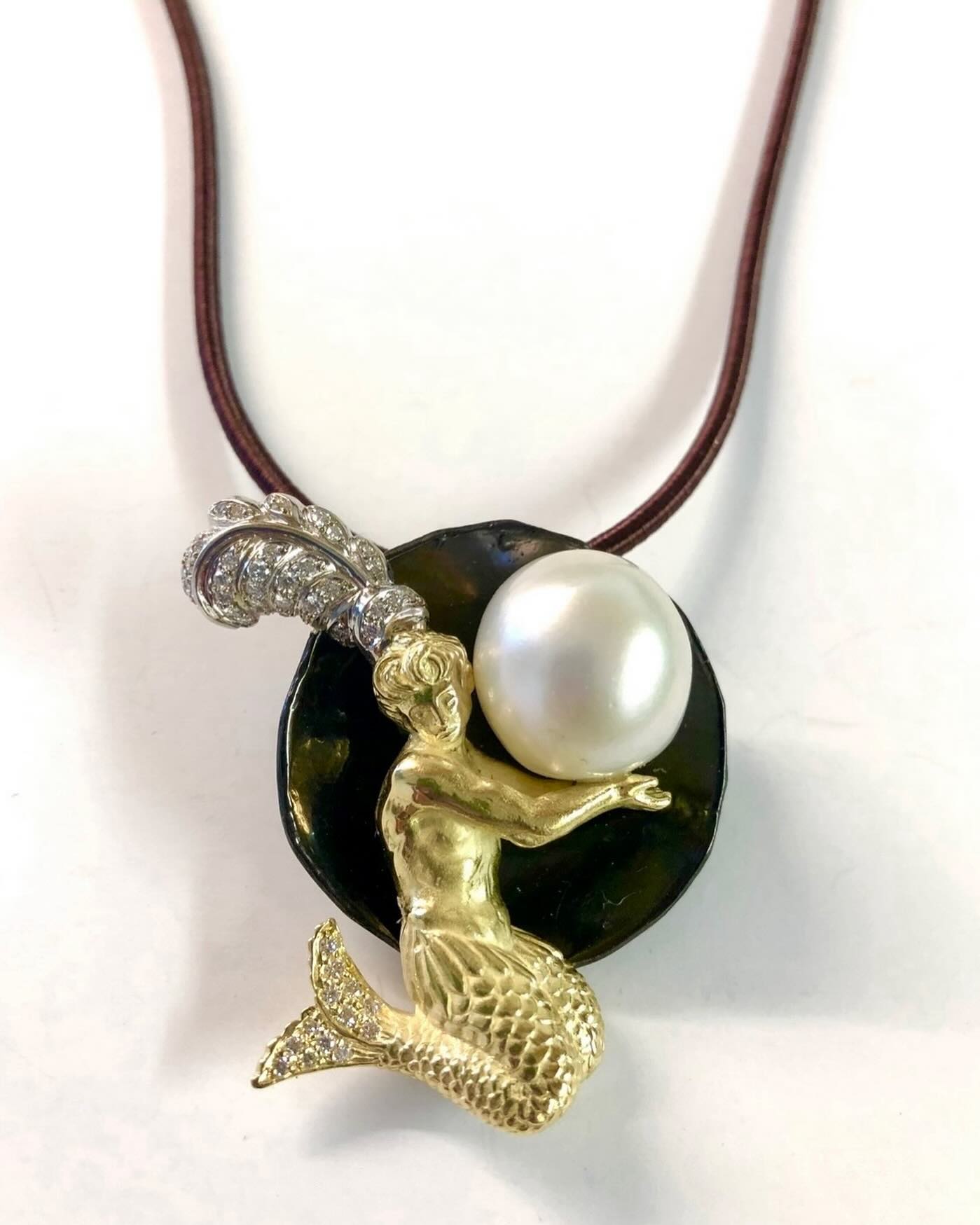 Live with panache and keep giving back. A pendant with a large pearl, diamonds set on 18k. gold and blackened steel #artistic #artisan #fineartcollector #artcollector #thegiftthatkeepsgiving #giver #one of a kind Jewelry #pearlsjewelry #giftsforher #giftsforalloccasions