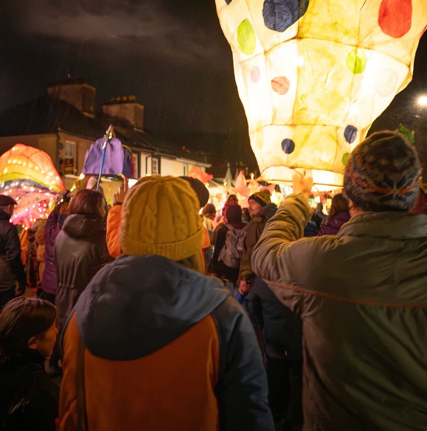 Last night — coats on, gloves pulled back out from the dusky depths of the cupboard, and hats that may not survive another winter pulled firmly over ears — we bundled ourselves up and set off toward Machynlleth.
(Shortly after, we had to pull over and unbundle ourselves, because an hour in the car with that many layers, the heating on, and the music up was never going to last long.)
We arrived in the rain. The proper Welsh kind — not the romantic drizzle sort, but the one that makes you question whether someone’s turned a sprinkler on above your head. Cameras were tucked under coats as we dashed out, trying to keep the lenses dry.
But by 6:30, as the drums of the samba band began to roll down the street, the rain stopped. Puddles pooled in the road, catching the glow of the lanterns and throwing the light back in the most magical way.
Lanterns glowed in the damp autumn air, weaving through the streets like ribbons of light. The samba rhythm carried laughter and footsteps along the cobbles, leading the procession towards the football club, where fireworks waited beyond the dark.
Through our lenses, the evening became a tapestry of colour, movement, and fleeting moments — each lantern a story, each reflection a little spell of its own. Capturing it felt like chasing wisps of light through a town that shimmered with autumn magic.
#MogwaiMedia #LanternMagic #Machynlleth #MidWalesStories #autumnevenings #paperlanterns #magicmoments #magic