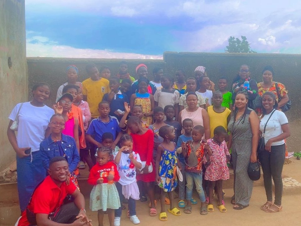 On September 2, 2025, ten members of Youth Timebanking Cameroon (YTBC), led by their president Claude Michele, visited a local orphanage with a mission to share time, joy, and solidarity. What started as a simple social visit turned into a vibrant celebration of togetherness. The youth shared a meal with the children, filling the space with laughter, music, and dancing. Every smile and song highlighted the power of small gestures to create lasting joy.
Along with fellowship, YTBC donated notebooks and reading books from their community store. Yet, the most meaningful gift was the invitation for the orphans to join YTBC. Through membership, the children can take part in activities, earn time credits, and redeem them for goods at the YTBC store. More than charity, it was an invitation to empowerment, inclusion, and belonging. For the orphans, this moment carried the promise of opportunities to learn, grow, and contribute actively to their community.
For the young visitors, the experience was equally impactful. Witnessing the resilience and joy of children with so little reminded them of the value of humility and gratitude. They left the orphanage with full hearts, cherishing the memories of shared meals, dancing, and laughter. Most importantly, they carried a renewed commitment to service. The day was not the end of a project, but the beginning of a deeper resolve—to continue creating opportunities, spreading joy, and building bridges of hope across their community.