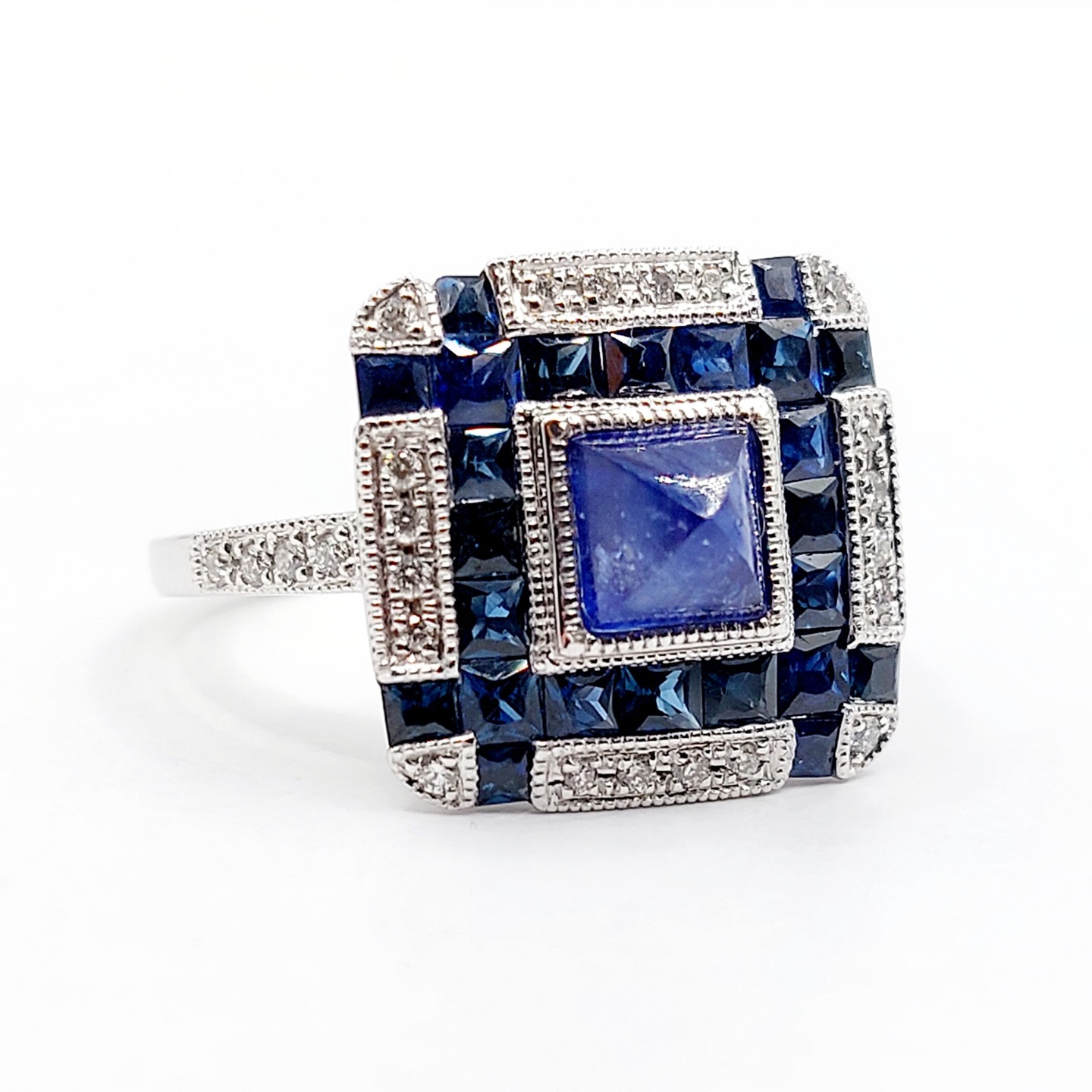 ///Sold/// French Platinum Art Deco style ring set with 1.10 carat sugarloaf sapphire surrounded by calibrated sapphires and diamonds (Branar Paris)
PRICE : 2700 €
Magnificent craftsmanship from the House Branar Paris
Size: 54 FR / 7 US
Weight: 6.75 g
Sapphire size: approximately 5.0 x 5.0 x 4.0 mm (estimated at 1.10 carats)
Stones in very good condition, beautiful natural inclusions in the sapphire
Head size: 14.9 x 14.1 mm
Micro scratches from use
Ring numbered and signed Branar on the inside
Dog head hallmark and PT900 (French hallmark)
#frenchjewelry #diamond #diamondring #antiquering #victorian #victorianring #marquisering #augustusjewels #vintagering #daisyring #daimondhaloring #tankring #platiniumring #platinum #platinumring