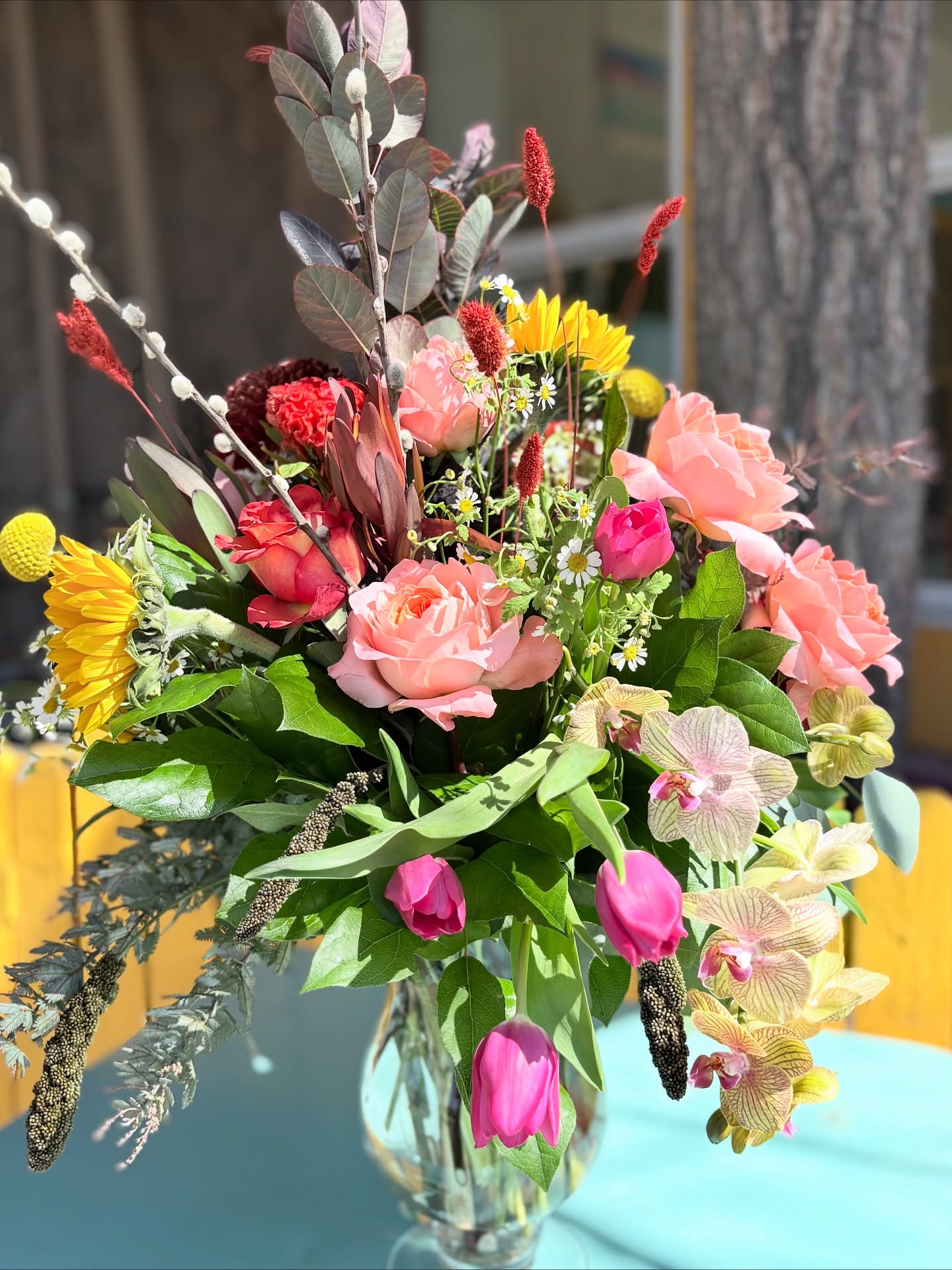 💐A timeless garden of orchids, tulips, roses, and sunflowers gathered in a graceful glass pedestal, where elegance meets sunlight.💞 #adoberosecustomflorist #anniversary #elegant #ep #eptx #flowers
