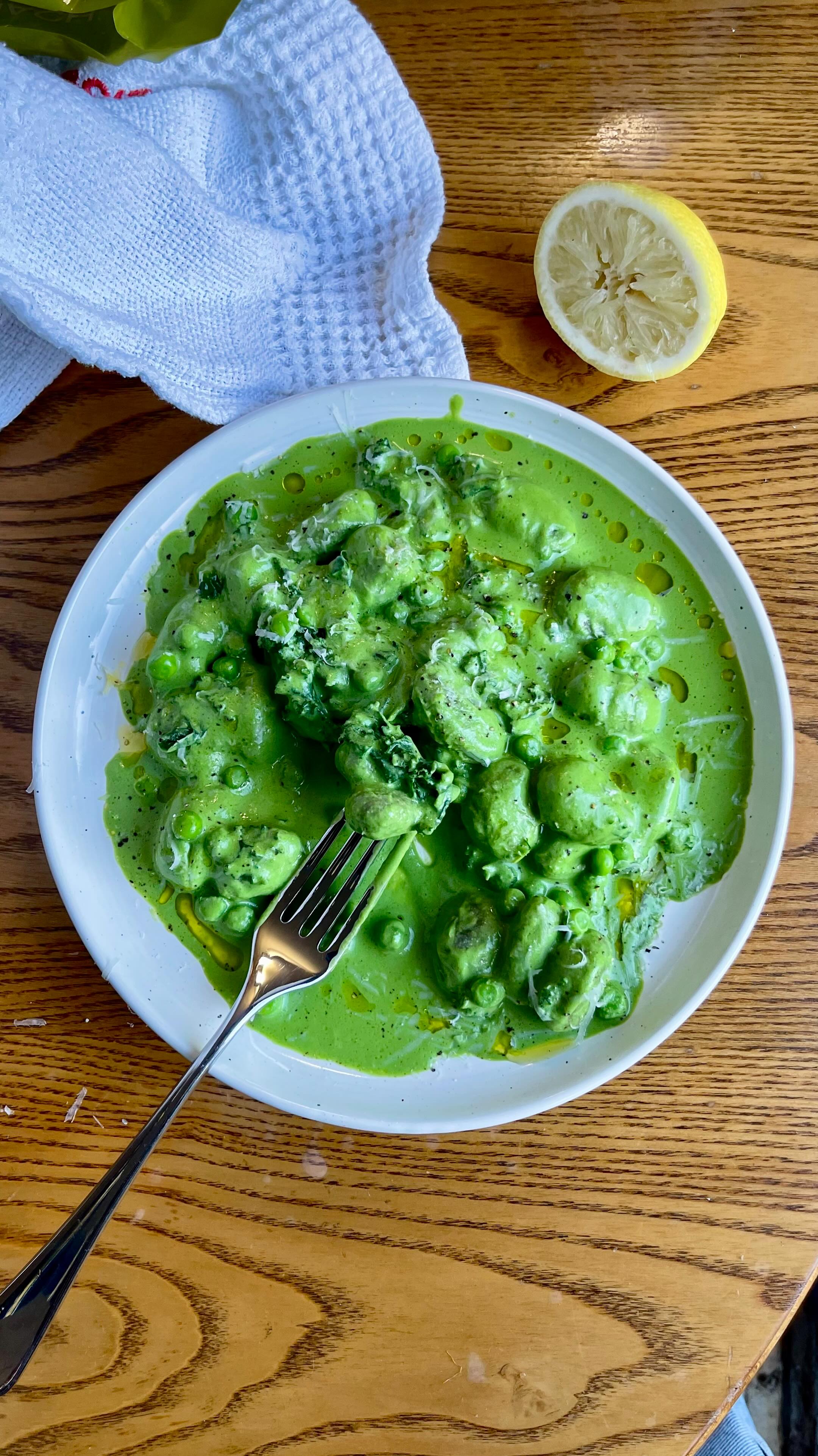 Super Green Spinach Gnocchi 🌿
The dreaded flu is on another rampage right now, so give yourself some extra immune protection with this super easy blended spinach & ricotta sauce.
I’ve added some lightly boiled peas and kale for extra green nutrition, but you can substitute for any green veggies you might have in your fridge!
With Sunny & Luna Spinach Gnocchi, which counts as 1 of your 5 a day, this recipe is an easy and delicious way to get lots of veg in 💚
You can make it vegan by using silken tofu in place of the ricotta and nutritional yeast in place of the parmesan.
You’ll need -
Sunny & Luna Spinach Gnocchi
2 handfuls of spinach
Small bunch of parsley
Around 150g ricotta
60g parmesan, grated
Juice of half a lemon
Salt & pepper
Extra Virgin Olive Oil
Optional - extra veg e.g. peas, kale, broccoli, chard etc. boiled lightly according to their cooking instructions.
Heat a pan with 1 tbsp olive oil and add the spinach gnocchi. Cook for 3 minutes until starting to brown. Add a splash of water and return to the heat for a further 2 minutes. The finished gnocchi should be slightly crispy on the outside, plump and squidgy.
Add the spinach, parsley, ricotta, parmesan, lemon, extra virgin olive oil and seasoning to a blender and blitz until smooth. Don’t worry if it feels quite thin, it will thicken up when you warm it through.
Add directly into the pan with the gnocchi - enough to coat the gnocchi generously without drowning them. Any remaining can be kept in a sealed jar in the fridge for 2 days.
Warm the sauce through, add the boiled vegetables, and mix well. Serve immediately with a drizzle of extra virgin olive oil, and some parmesan.