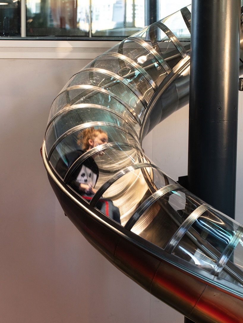 Carsten Holler is a German artist, and he is dang cool. Carsten hollers’ exhibitions have this modern appeal to do it because of the color tones of the locus.
He was a scientist before becoming an artist.
Höller earned a PhD in agricultural science and specialized in insect communication — specifically how insects use smell to find mates
Slide 1 - 4: DAC Slide, a permanent art installation by German-Belgian artist Carsten Höller, located at the Danish Architecture Center (DAC) in the BLOX building in Copenhagen, Denmark.
Slide 5 - 8: Giant Triple Mushroom (The artwork is part of the artist’s ongoing exploration of doubling and division, and his fascination with the psychoactive properties of mushrooms)
Slide 9 - 13: Clocks. The work explores the concept of time and challenges the conventional way we measure it. Höller’s fascination with clocks touches something deeper: our obsession with control. Timekeeping is humanity’s ultimate form of discipline — we use clocks to regulate behavior, work, and even emotion. By twisting that system, he invites viewers into a state of liberation and unease — a brief glimpse of life outside control.