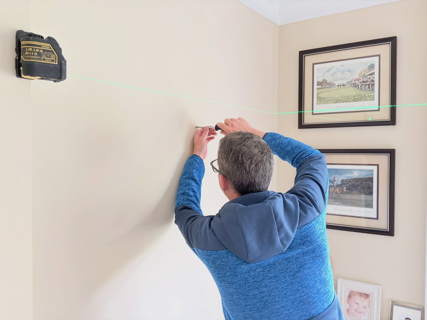 Getting some artwork and pictures hung today with Matt. A specialist ready to help our customers. #picturehanging #handymanservice #wallmounting #diy