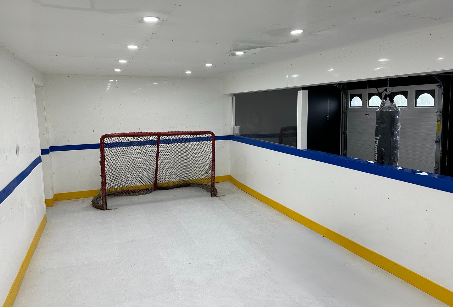 🏒 From Garage to Game-Ready
Another custom Slapshot Structures build. This in-home shooting pad is designed for all-season training with pro-style boards, clean finishes, and a slick dryland surface.
Whether it’s working on your shot, stickhandling drills, or adding a workout zone like this one - we build spaces that help players train harder and play smarter.