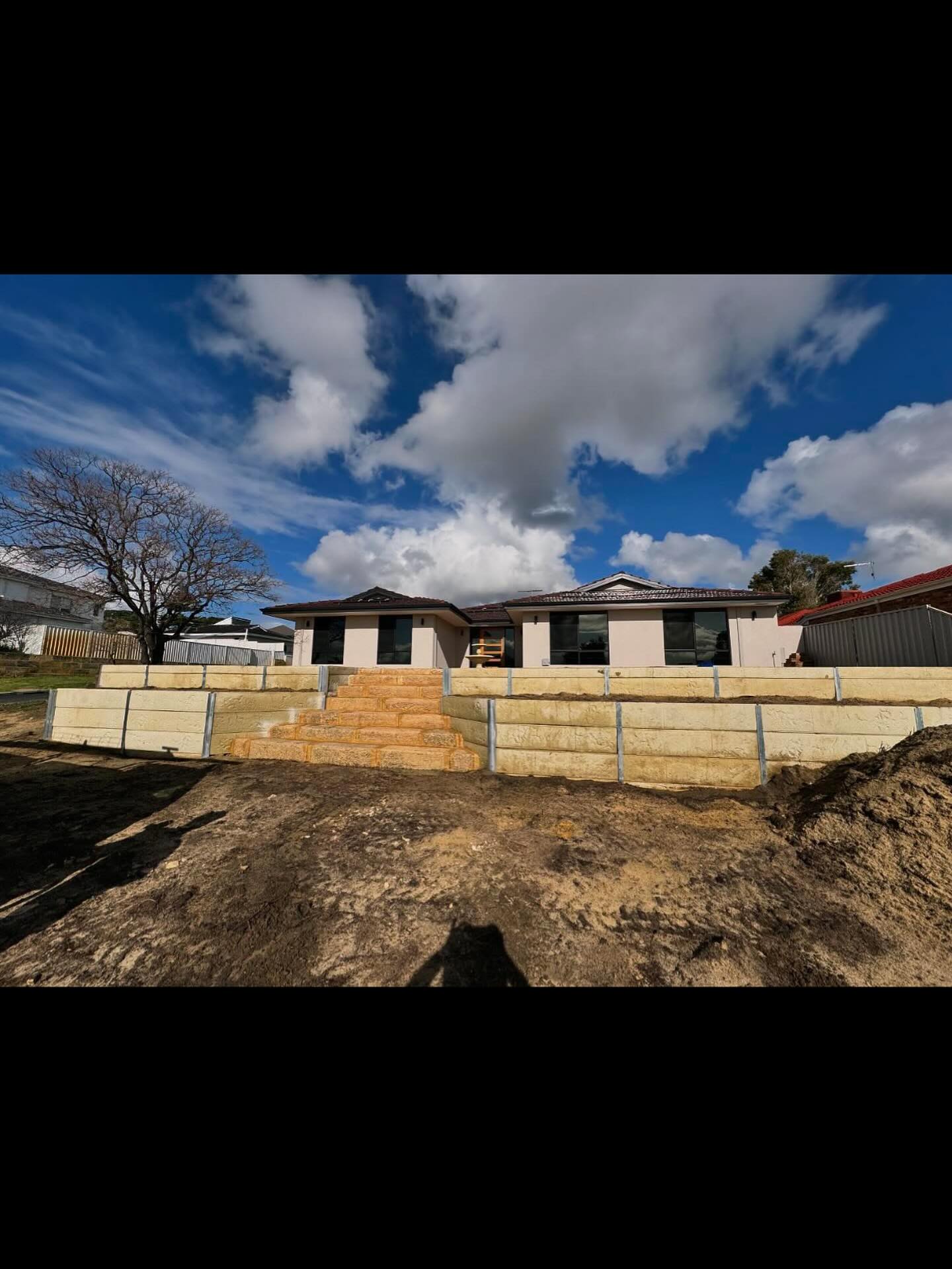 Making unusable land useable again!
Concrete sleeper walls and recycled limestone stairs doing the job!