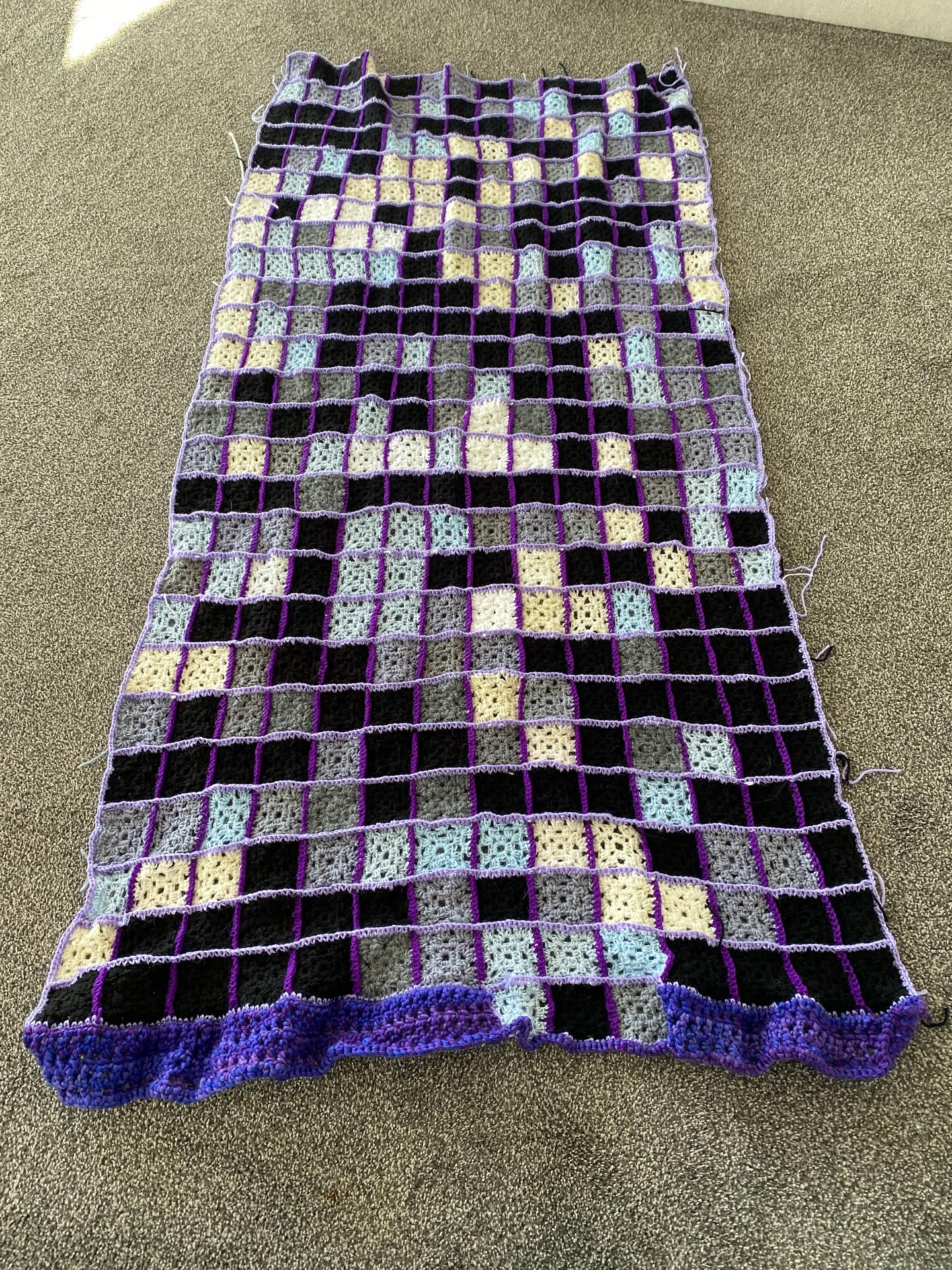 The blanket of granny squares depicting the effect my daily pain level has on my ability to function like a person not living with a chronic condition is all assembled. Thinking about the border and backing now. Purple is the official colour for migraine awareness, so I used that to connect the bits and fill in the gaps. #migraineawareness #migrainewarrior #migraineart