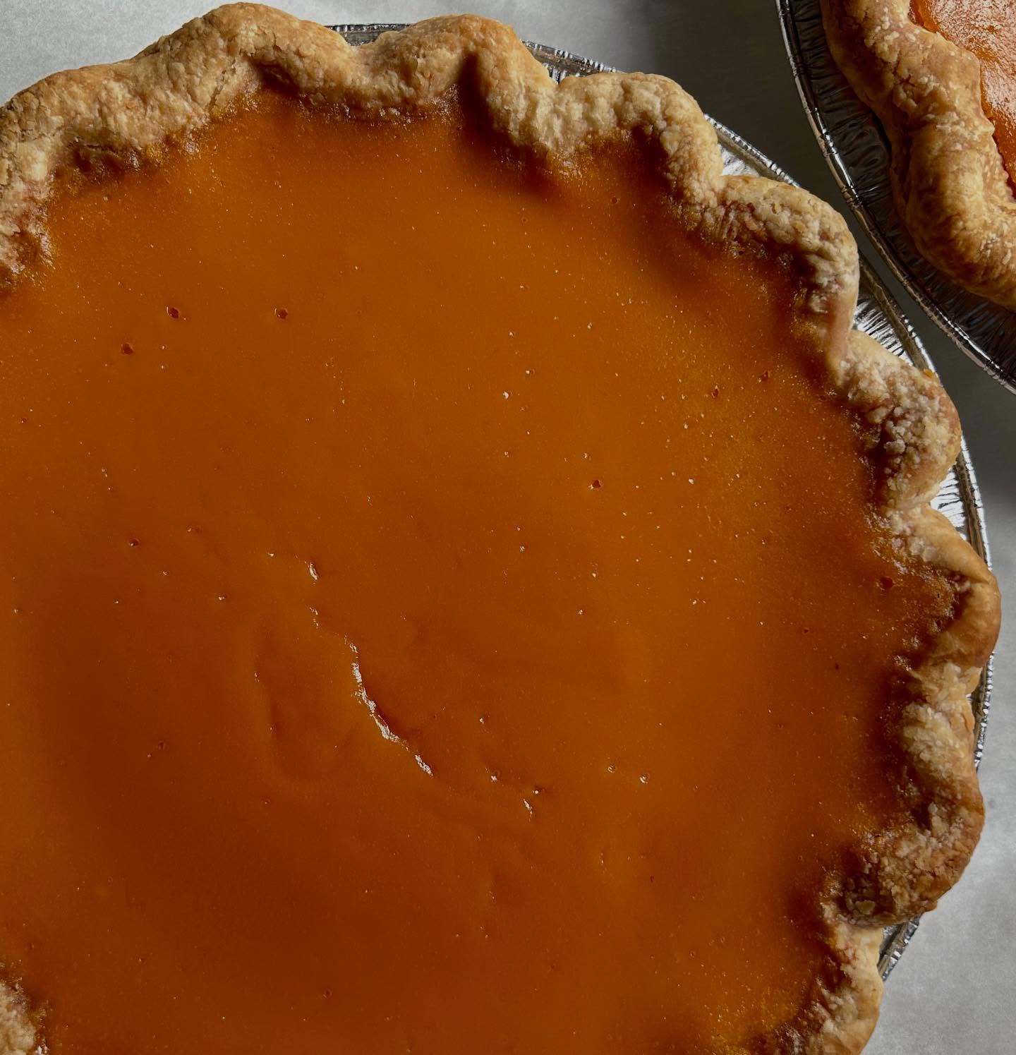Sweet potato pie is on the thanksgiving menu, & slices are available @bexley_natural_market today! Organic sweet potatoes from @9nfarm are slow roasted to condense their flavor, then blended into a smooth custard with @wholesomesweet organic brown sugar, @plugrabutter, @snowvillecreamery cream, @truestfarms eggs, vanilla & just a hint of spice. Delicious & comforting. Enjoy! 🧡