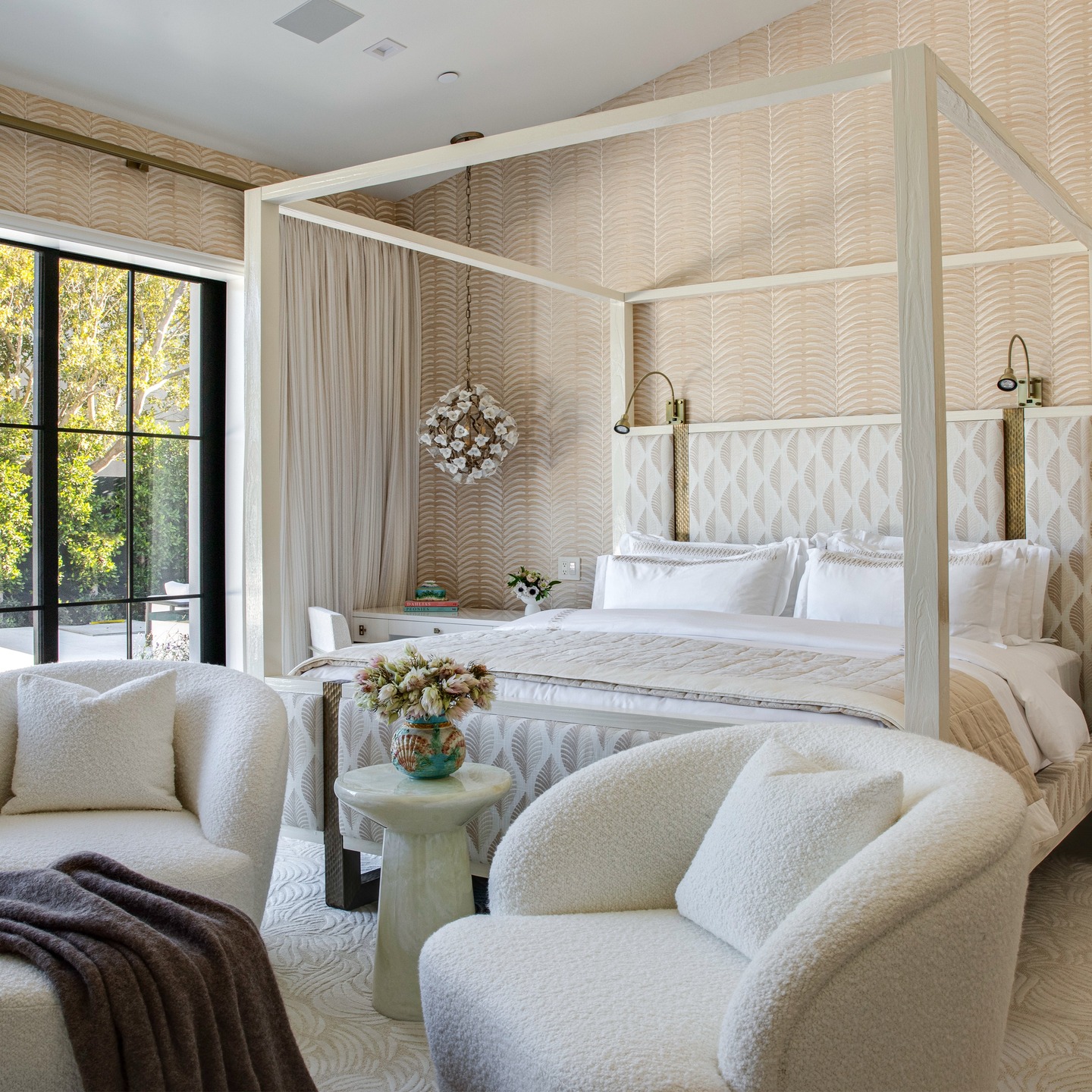 This primary suite was designed around a palette of warm, rich neutrals, layered with soft textures, subtle patterns, and a hint of sheen for depth and dimension.
The onyx fireplace adds an elegant glow, while custom shelving showcases the client’s beloved antique collection.
From the bouclé chairs to the sculptural lighting and textured wallpaper, every detail comes together to create a retreat that feels elevated, personal, and timeless.
Interior Design: @lindseymillerinteriors
Photography: @mellon_studio
#HaveFun,BeBold #LuxuryInteriors #PrimarySuiteDesign #WarmNeutrals #QuietLuxury #CollectedInteriors #SophisticatedSpaces #OnyxFireplace #InteriorDesign