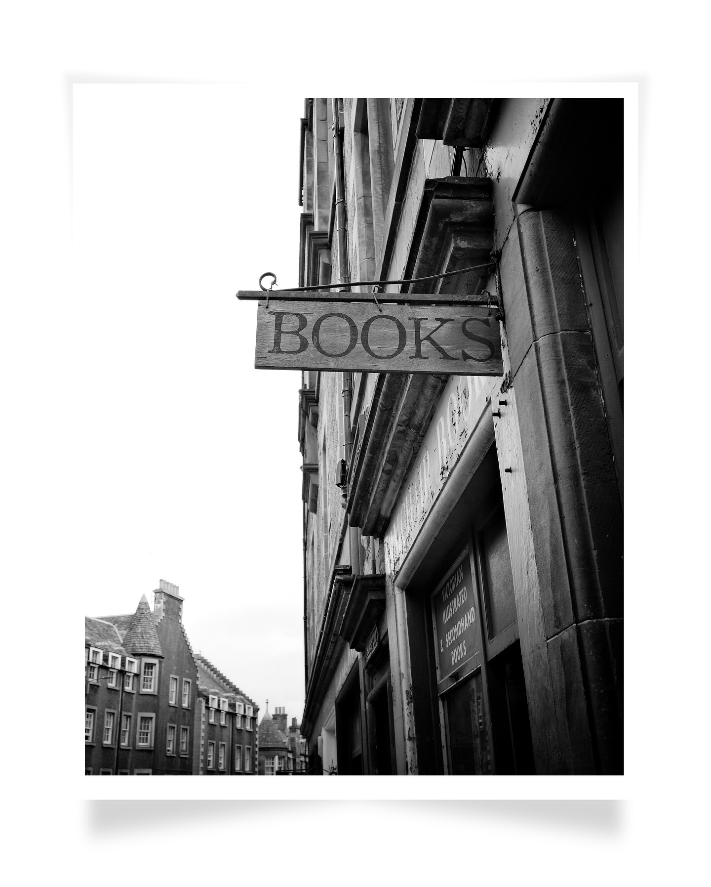 The simplest things in life are often the most enjoyable.
I took this shot this past summer in Edinburgh, right outside the wonderfully ramshackle ‘Armchair Books’, almost in the shadow of the Castle.
In a world full of screens and tech, there’s just something so grounding about a used bookstore full of physical books. It’s that joy of getting lost turning pages. It’s like flipping through an old photo album - it just draws you in completely.
I assume that’s why my new ‘Bookstores’ Collection’ has been such a hit (thank you all so much for the love!). It seems like we all still crave that tangible connection to stories and art. This ‘Literary Signpost’ print is a nice little piece of that magic.