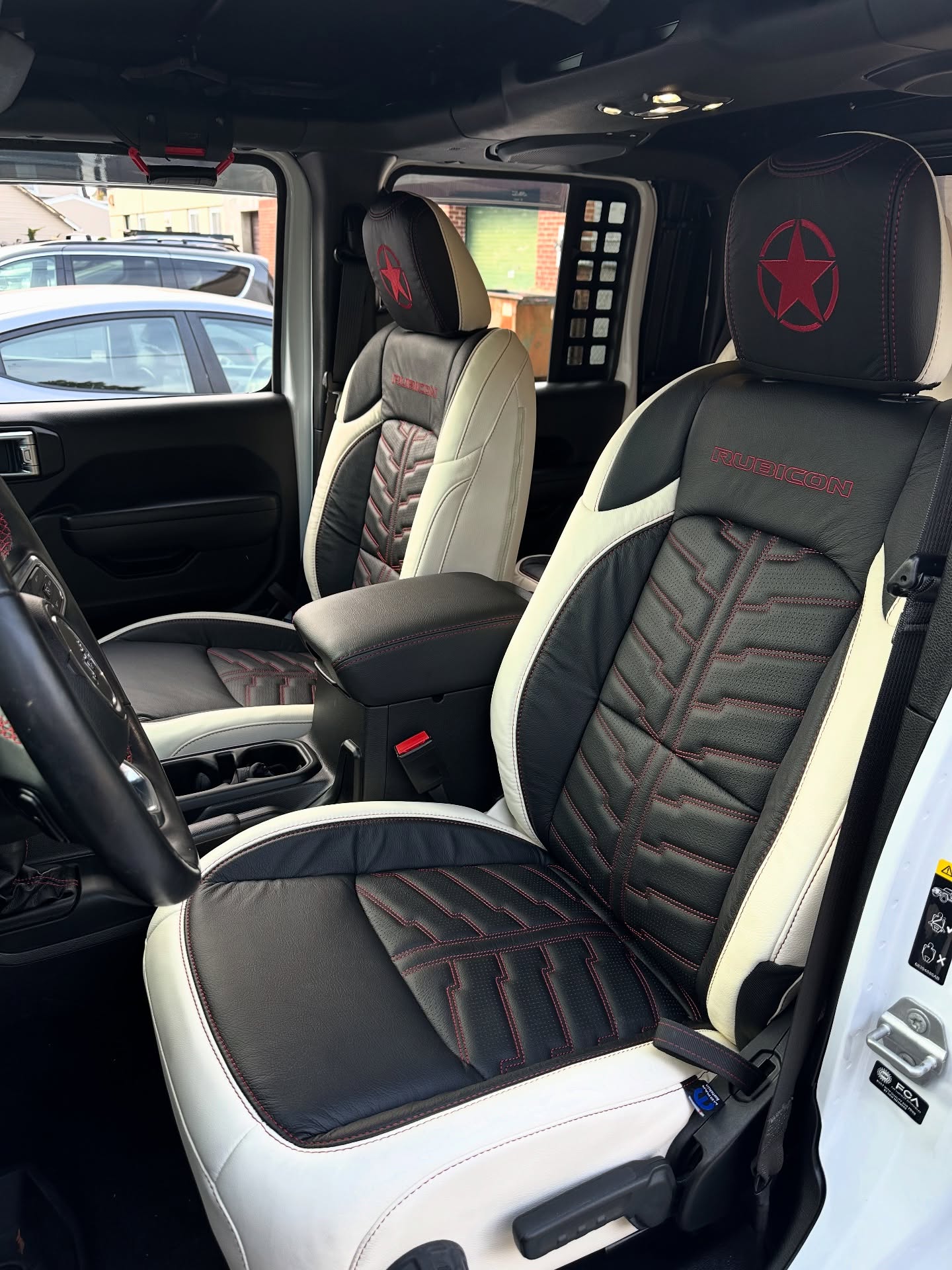 This Jeep Gladiator Rubicon got a refresh with a @katzkin_leather Pearl and Black interior with Electritek inserts, Rubicon logo and custom star embroidery in the headrests. #jeep #jeepgladiator #rubicon #mopar #leather
