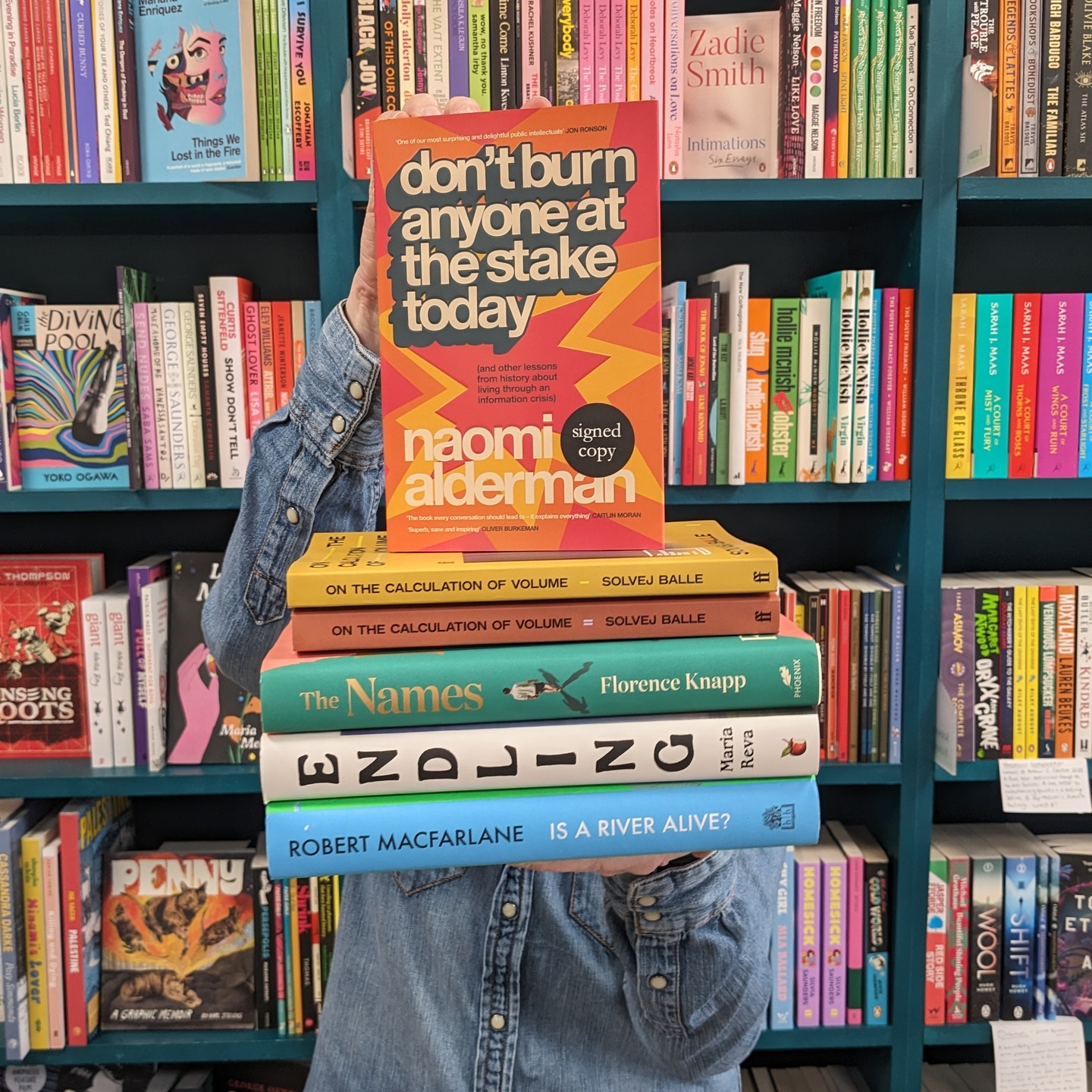 📣From behind the stack of books comes Nic's favourite reads of 2025.
"I’ve read 175 books so far this year, so it’s really difficult to pick my favourites!
Here are some highlights which I’m dying to share with everyone."
📖On The Calculation of Volume I, II & III by Solvej Balle, translated by Barbara J Haveland.
For Tara, every day is 18th November. Everyone else is experiencing 18th November for the first time; she must re-live it repeatedly. Poetic and closely observed, the writing is brilliant and profound, dealing with philosophical questions with a lightness of touch. Makes me wonder what would I do?
📖The Names by Florence Knapp.
Cora ponders three name options for her baby. Will he be Gordon, Julian or Bear? Each choice leads to very different lives, which unfold over the years. Moving, powerful and very readable, this broke my heart again and again.
📖Endling by Maria Reva.
Yeva is a scientist in Ukraine, trying to save endangered snails and funding her efforts by dating Western men on ‘romance tours’. With an inventive structure, and addressing themes of power, gender and colonialism, I was very impressed by this funny and clever debut.
📖Don’t Burn Anyone at the Stake Today by Naomi Alderman.
An essential and insightful short nonfiction book, which considers some of the most pressing issues of our time. We’re living in the third information crisis: first humans invented writing, then the printing press, now the internet. How is this affecting our psychology and behaviour? The author uses history and philosophy to examine our modern age. I wanted to give this to everyone as soon as I read it!
📖Is A River Alive? by Robert Macfarlane.
A truly wonderful book about rivers, life, and the more-than-human world around us. Written beautifully with passion and knowledge. A balanced blend of nature writing, politics & environmentalism, and ideas. The best part for me was the inspirational people that he meets.
#booksoftheyear #2025books #booksrecommendation #bookrecs #bookrecommendationsofinstagram #staffpicks #bookshop #bookrecommendations📚❣️#bristolbookshops #bristolbookstagrammers #booksbooksbooks #indiebookshop