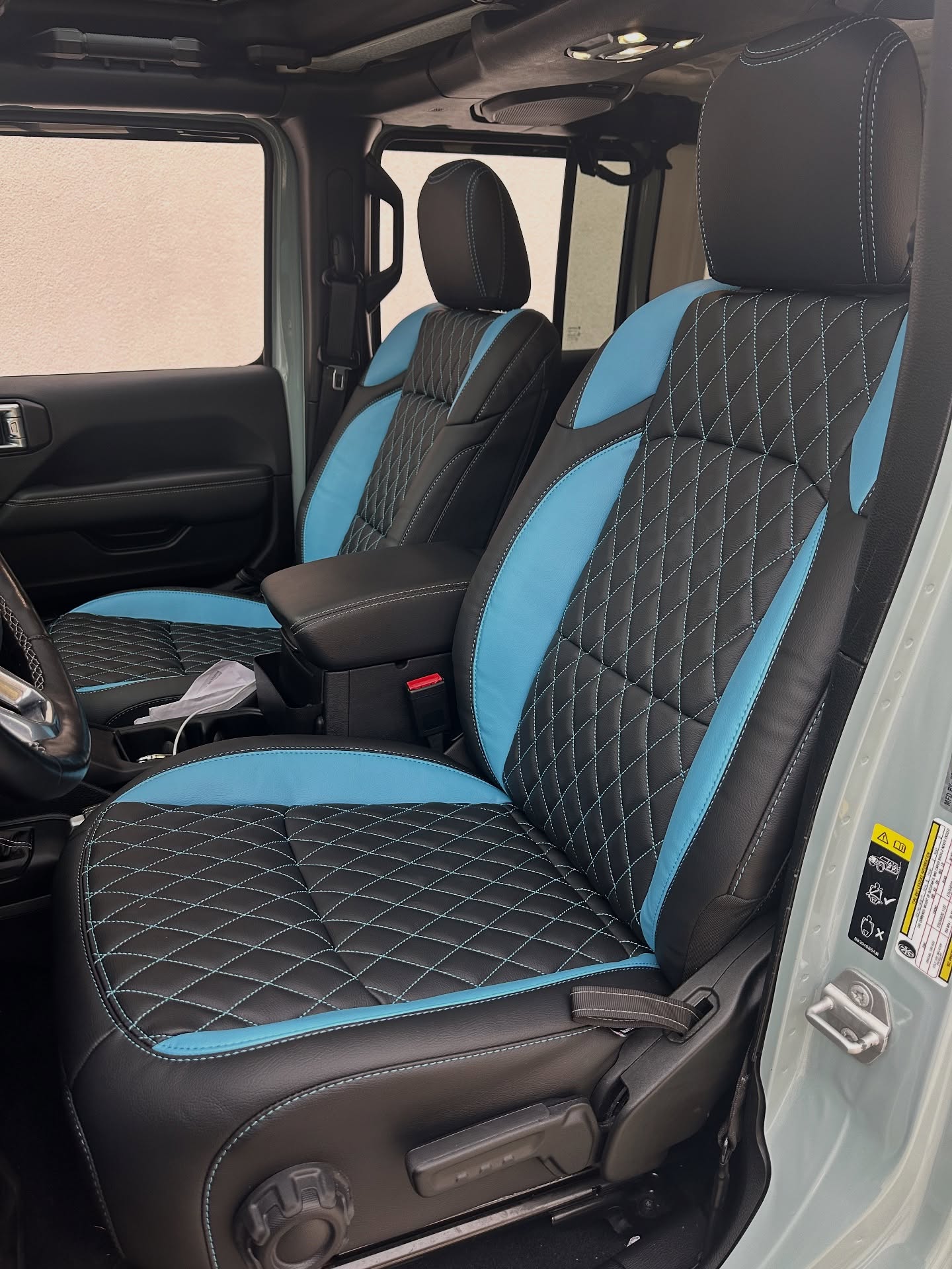 Custom diamond @katzkin_leather leather-trimmed interior. Black with Bahama wings and stitching. A similar design can be made for you! #jeep #4xe #wrangler