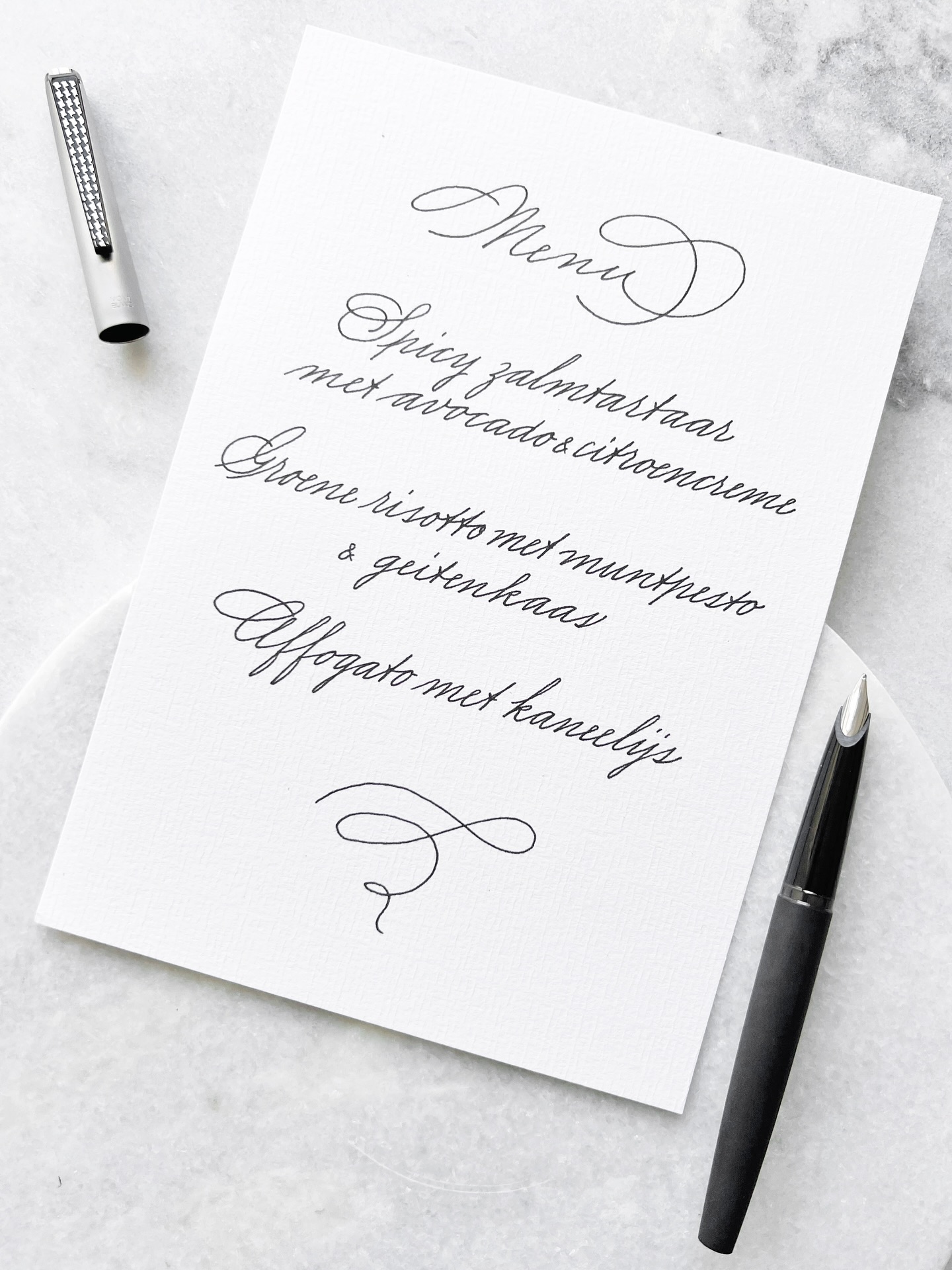 A handwritten menu sets the tone long before the first course arrives: a personal touch no typeface can replace. Written with a @montblanc Caressa
Een handgeschreven menu laat je gasten weten dat er tijd en aandacht aan ze is besteed, nog voor ze bij je aanschuiven 😉 Ik hou enorm van pied de poule motieven en dus ook van deze prachtige Montblanc Caressa vulpen🤍🖤🤍🖤
#handwritinggoals #handwritingchallenge #handwritingpractice #handwriting #handwritten #handwriting #handwritting #calligraphymenu #montblanccaressa #handwritingchallenge #handwritingexpert #handwritingcommunity #handwritingskills #handschrift #handgeschreven #handgeschreven #kalligrafie #kalligraferen #fountainpennetwork #fountainpenaddict #vulpen #montblanc #montblancpen #fountainpen #fountainpens #americancursive #fountainpencommunity #fountainpennetwork #fountainpenlove #penfluencer #luxurypen #fountainpenaddicts #fountainpenaddiction m #vulpen #cursivewriting