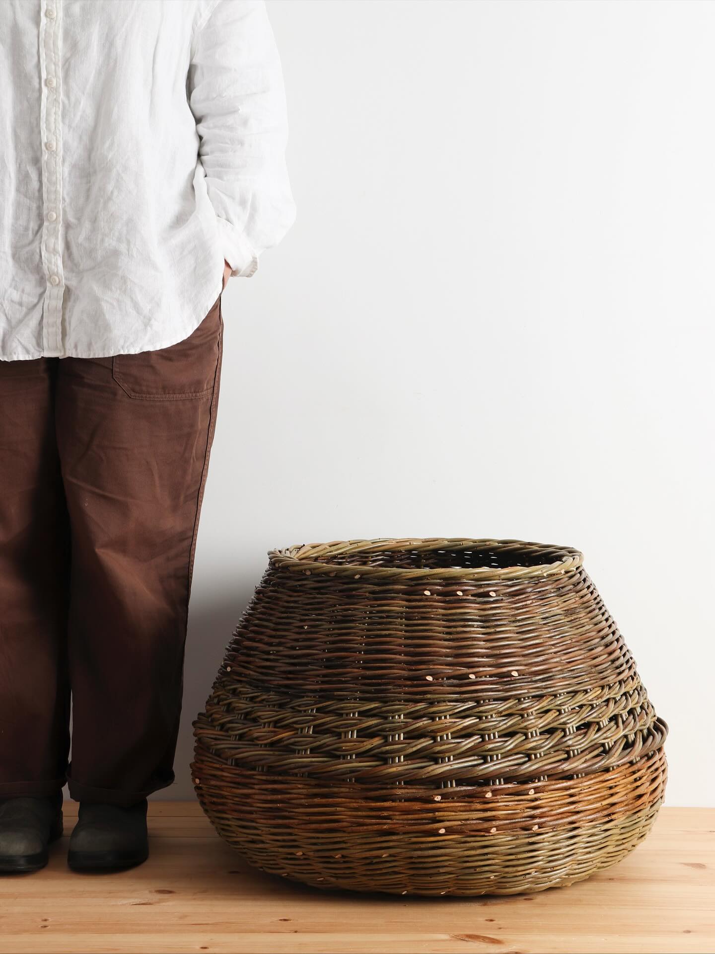 Form and function - a contemporary design of my own, this large piece works as both a functional storage basket and as a statement sculptural piece for the home.
Woven in a range of willow varieties, showcasing the beautiful colours of this natural material; a combination of our home-grown willow and Somerset willow.
Available on our online shop as part of our AW collection.
Sarah