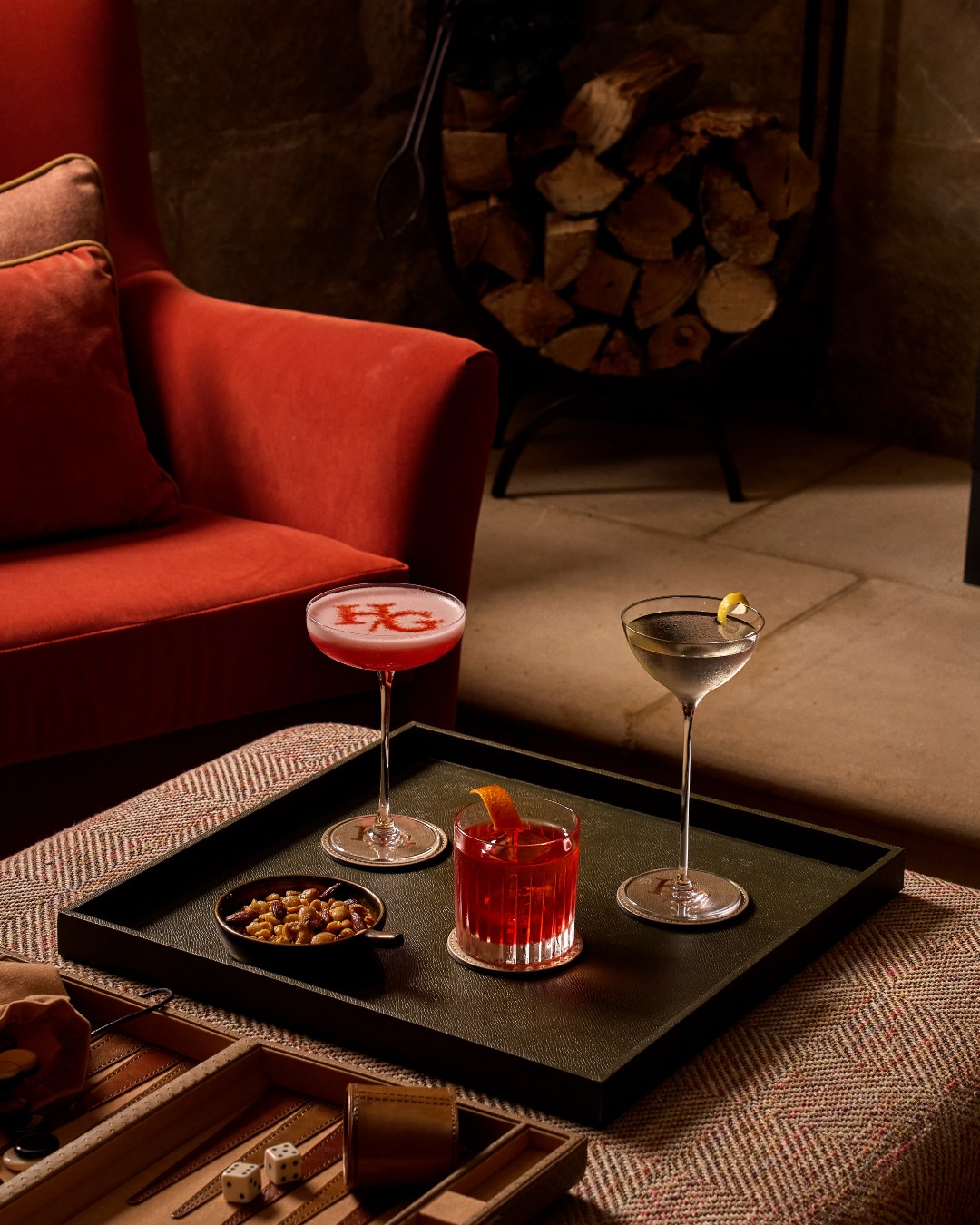 Our snug is the perfect hide away on a chilly evening.
Grab a cocktail, some salted nuts from the bar and play a board game alongside the roaring fire.