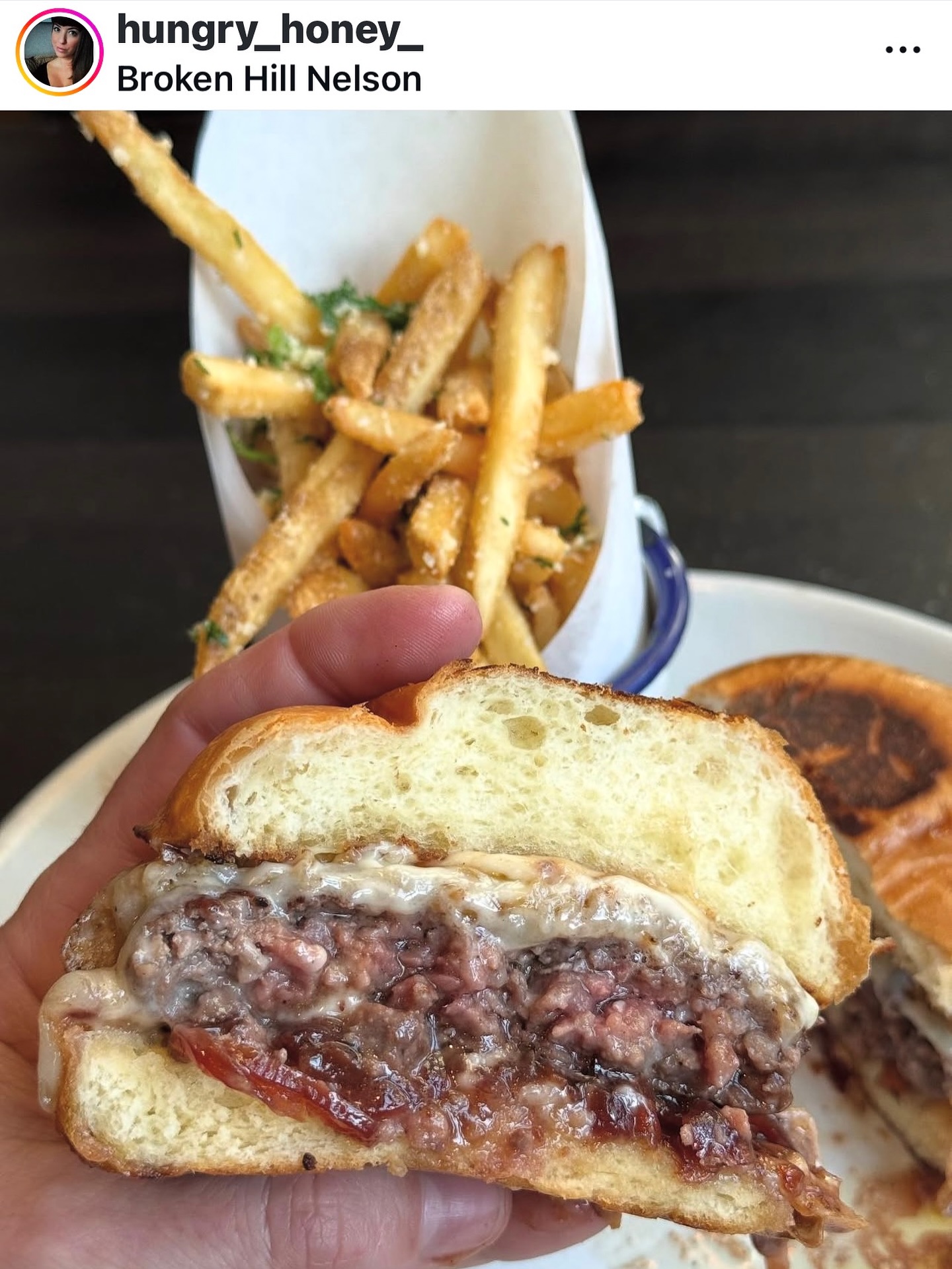 The @hungry_honey_ review👇 We’ve been on pins and needles waiting…
“Everyone keeps asking, “When are you finally gonna review Broken Hill?” Yeah, I’ve been putting it off. Maybe I want to give the smaller spots their moment in the sun before I start pumping the tires of the reigning champions. Or maybe I’m afraid if I admit that I licked the plate clean after eating this controversial entry, the Facebook warriors will come for me and I’ll get cancelled. (I’ve decided to leave this whole ethics debate on the side of the plate, untouched).
Either way, I know that the chef follows my Instagram, and at this point, he’s probably starting to wonder, “what are we, chopped liver?”
I’ve heard very mixed reviews on this Burger. Half the town swears it’s divine, and the others claim it’s way too rich and they could barely finish their half. Well, challenge accepted, I’m riding solo today.
First off, this is a Smokehouse/ whiskey bar kind of vibe right? Did you say foie gras? I suddenly feel a bit under-dressed. This Burger sounds like it belongs at a pretentious French restaurant where you’re not allowed to wear sneakers. With ingredients this fancy, it feels almost disrespectful not to raise your pinky while taking your first bite.
Trust me, there was NOTHING classy about me eating this. I drove this thing into my mouth with more enthusiasm than a tiny Asian chick filming a Mukbang video for her YouTube channel. Yeah, it IS rich, but I really like that type of food. Bring on the butter, I ain’t scared. I would bathe in truffle oil if I could, and medium rare burgers are pretty much my love language. The foie was subtle, and the cherry onion jam brought a nice brightness to a dish that I can see why many of you thought was too heavy. This burger is so juicy my fingers practically got pruny just from holding it. “Pardon me, monsieur, may I bother you for another cashmere napkin?”
Now, if I go into cardiac arrest from going back for this decadent burger TOO MANY times this month, I have just one request… Make sure you serve it at my funeral so all my loved ones will know that I died happy.”
Thanks for all you do for all the restaurants Fe!