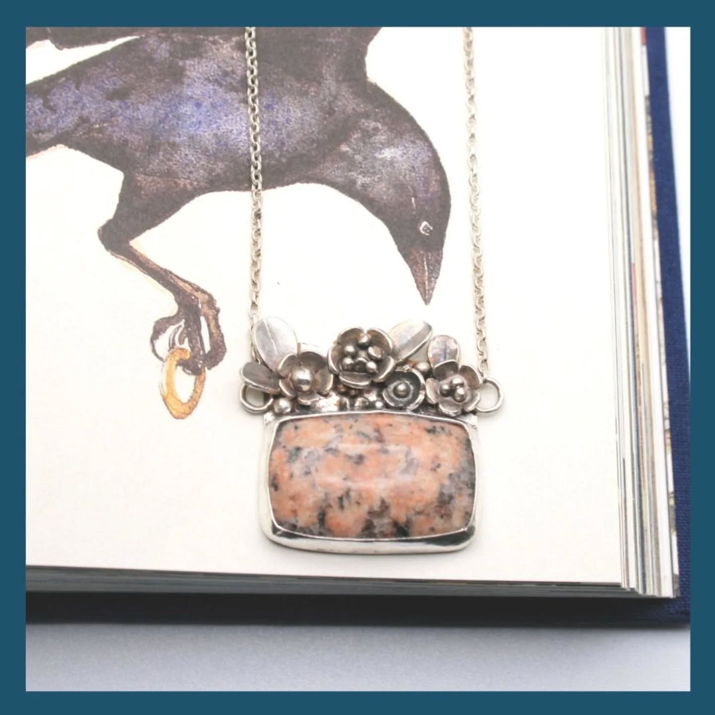 Today's cobblestone piece is a necklace with lots of little silver flowers sitting above the pink and grey speckled cobblestone. I love making little flowers and this necklace was probably the one that evolved the quickest and was the most fun to make. It did start as a sketch but I ended up just making a batch of flowers and playing around with their positioning before soldering them on.