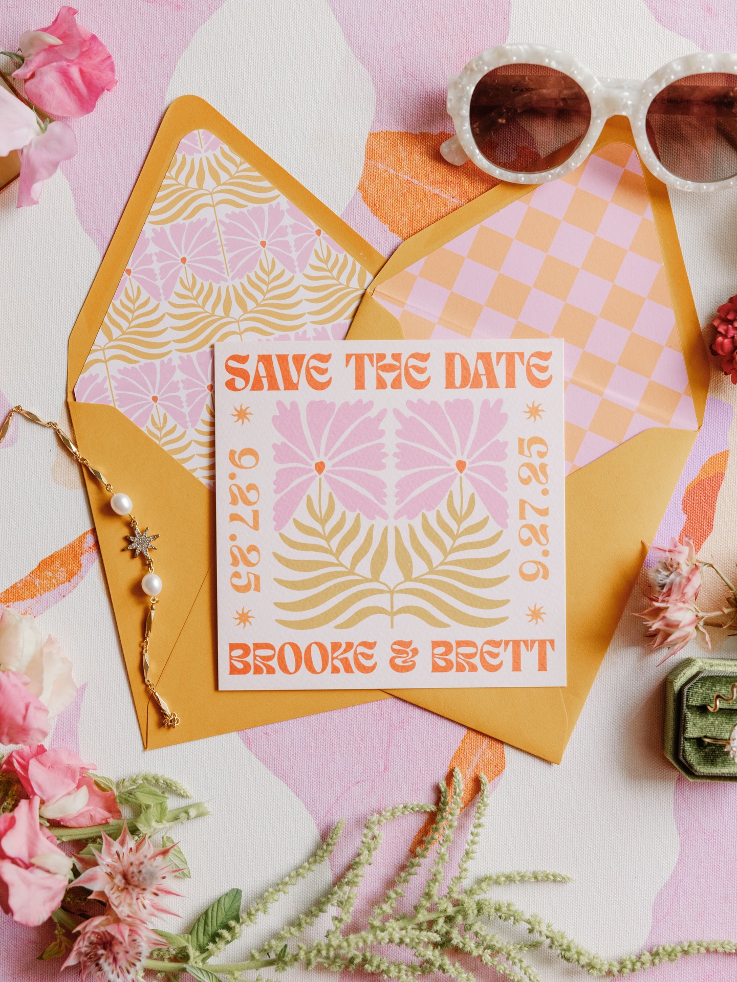 I love working with wedding planners to make couples dreams come to life, but when the planner is also the bride you just know it’s gonna be awesome and Brooke & Brett smashed it way out of the park!!
Our design journey started back in 2023, Brooke shared with me her vision for the styling and we had a call to discuss everything! We created a custom monogram using their matching initials which was used throughout their paper goods. I also designed custom save the date cards, a full stationery suite, matching custom shaped place cards and personalised match box favours.
I am so in love with how this all came together and as always very honoured to have been part of the team to bring it to life!
Design, planning, coordination, and bride: @sunburstsandstardust
Photo: @lovemedophoto
Signage and custom builds: @creameryhill
Florist: @kristenburdumy with Design by Terrain
Venue: @thehighlandsmansion
Custom dress and cape: @madisonchamberlain_
Caterer: @haddonculinarynj
DJ: @luvdupdjs
Super 8: @luvdupfilms
Sax player: @tylerclaytonappel
Tablescape details:@citrinetablescapes
Fringe installation: @luckydogstudio
Custom invites and day-of papery: @peachwolfe
Linens and napkins: @bbjlatavola @nuagedesignsinc
Rentals: @sjpartyrentals
Dance floor wrap: @gotoshout
Photo booth / video
confessional: @poserphotoboothco
Aura photographer: @igniteyouraura
Hair: @bridesbysette
Makeup: @mar.cobeauty
Dessert: @newjunebakery @helloseconddaughte r
Custom earrings and bracelet: @feast_jewelry
Groom suit: @indochinoweddings
Nails: @rebelnailsalon @veronicadoesnails
Rings: @jgkronenberger
Umbrellas: @mikaylateets
Transportation: @kinglimousine
Groom: @brett_woodmansee