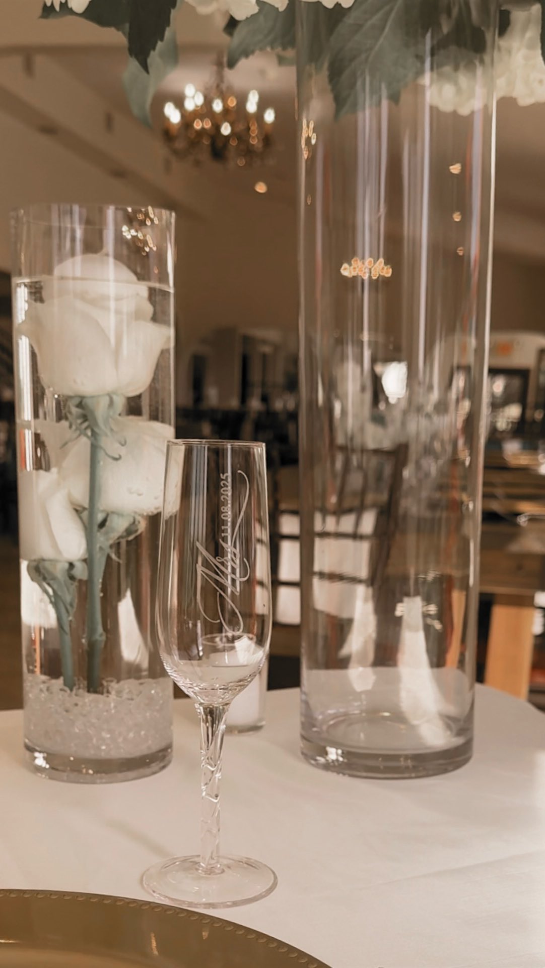 Ivory roses floating in the vase, tall glass vases with a soft luxury floral arrangement, and a table built for a love that feels timeless.
Tomika’s sweetheart table was pure elegance!
classic, modern, and utterly dreamy 🤍
There’s something sacred about those final moments before guests walk in…...Me placing their custom champagne glasses, adjusting every bloom, smoothing every layer, and giving the table its final touches. It’s my favorite part , watching intention turn into beauty right before my eyes.
Creating a space where my couples can breathe, be present, and soak in their first moments as husband and wife. That’s the heart behind Bloom In Grace Events ✨
📸🎥 Content: @eurostepglbl
🌹🌹Florals : @evemberfloral
#eventplanner #thedetails #eventdesigner #weddingday #sanantoniowedding #weddingseason #timeless #ivorywedding #virałreels