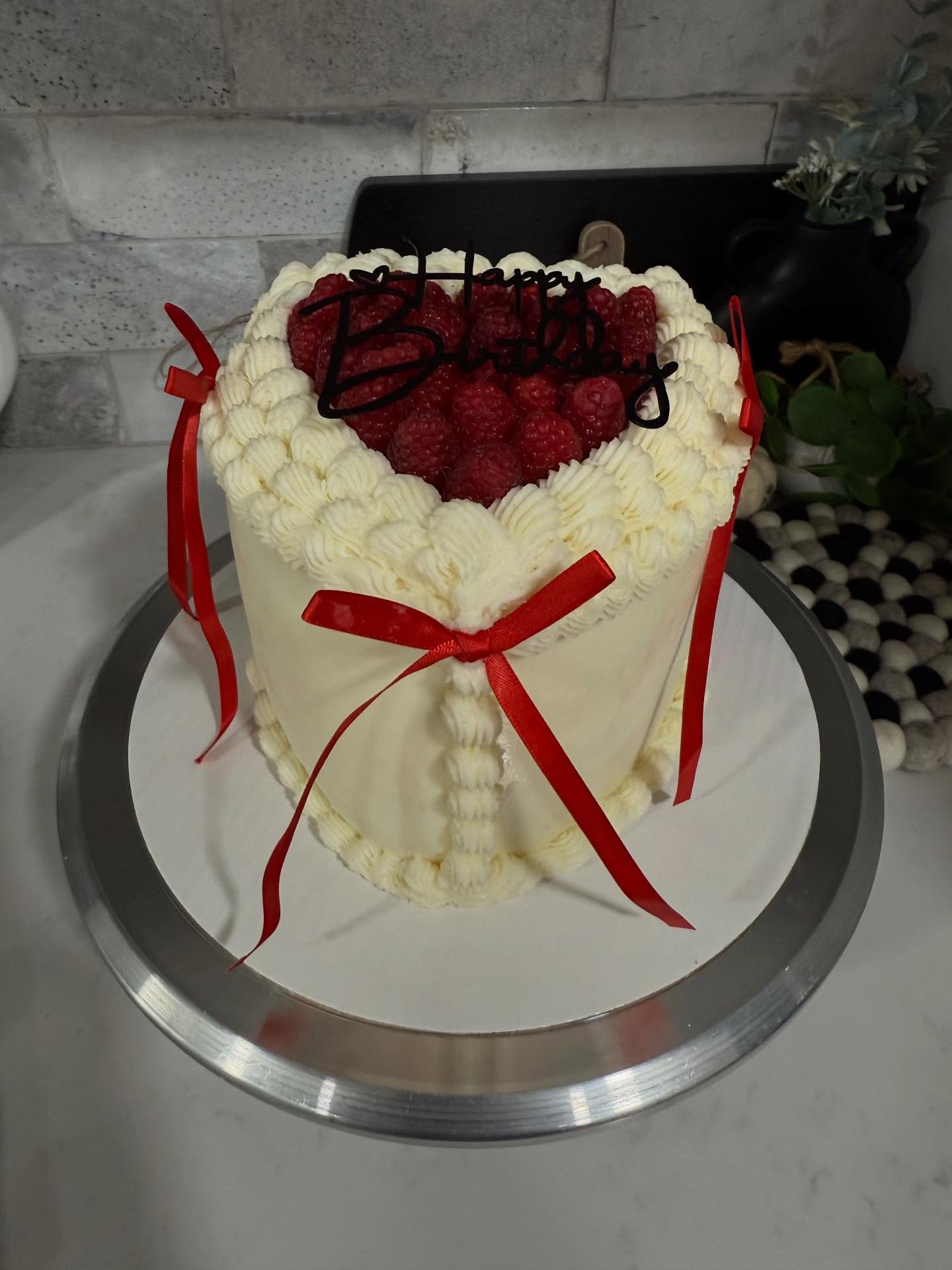 Raspberry white chocolate heart shaped celebration cake 🍰