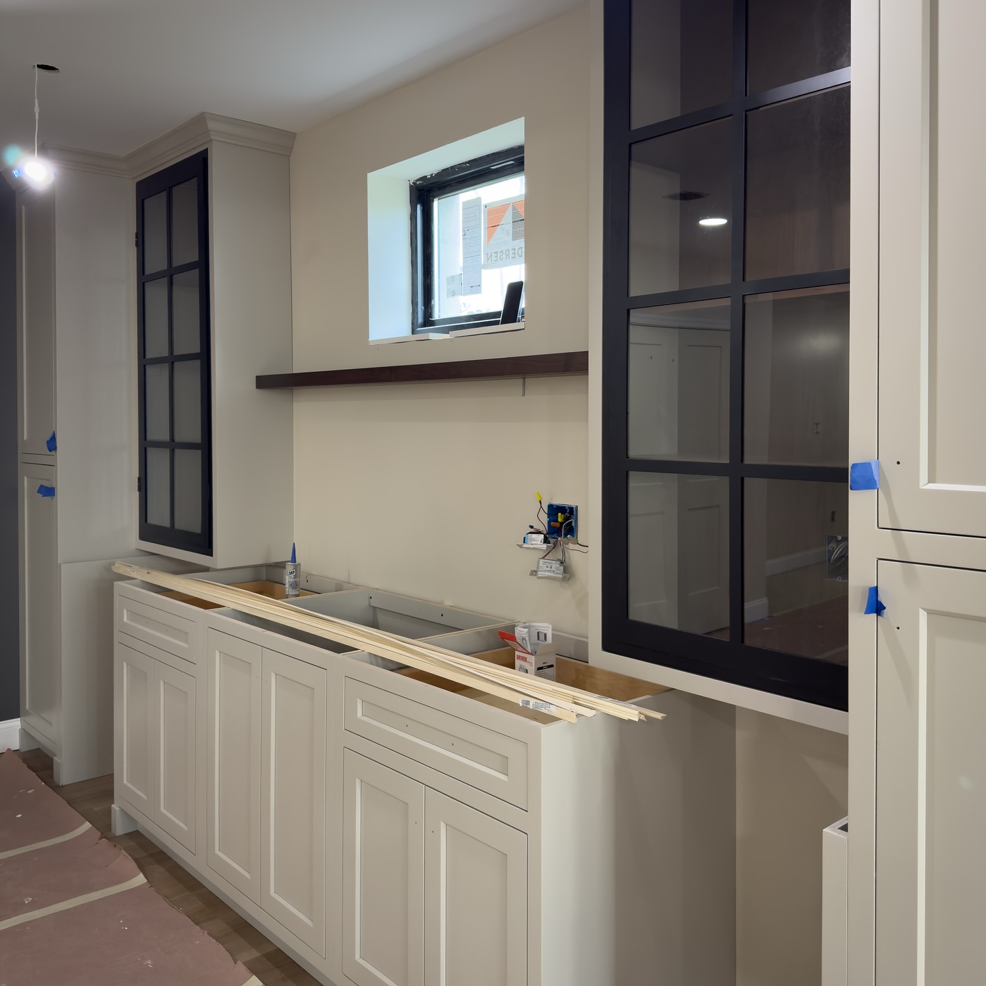 Beautiful cabinet install with custom metal doors going in at our borough project 😍