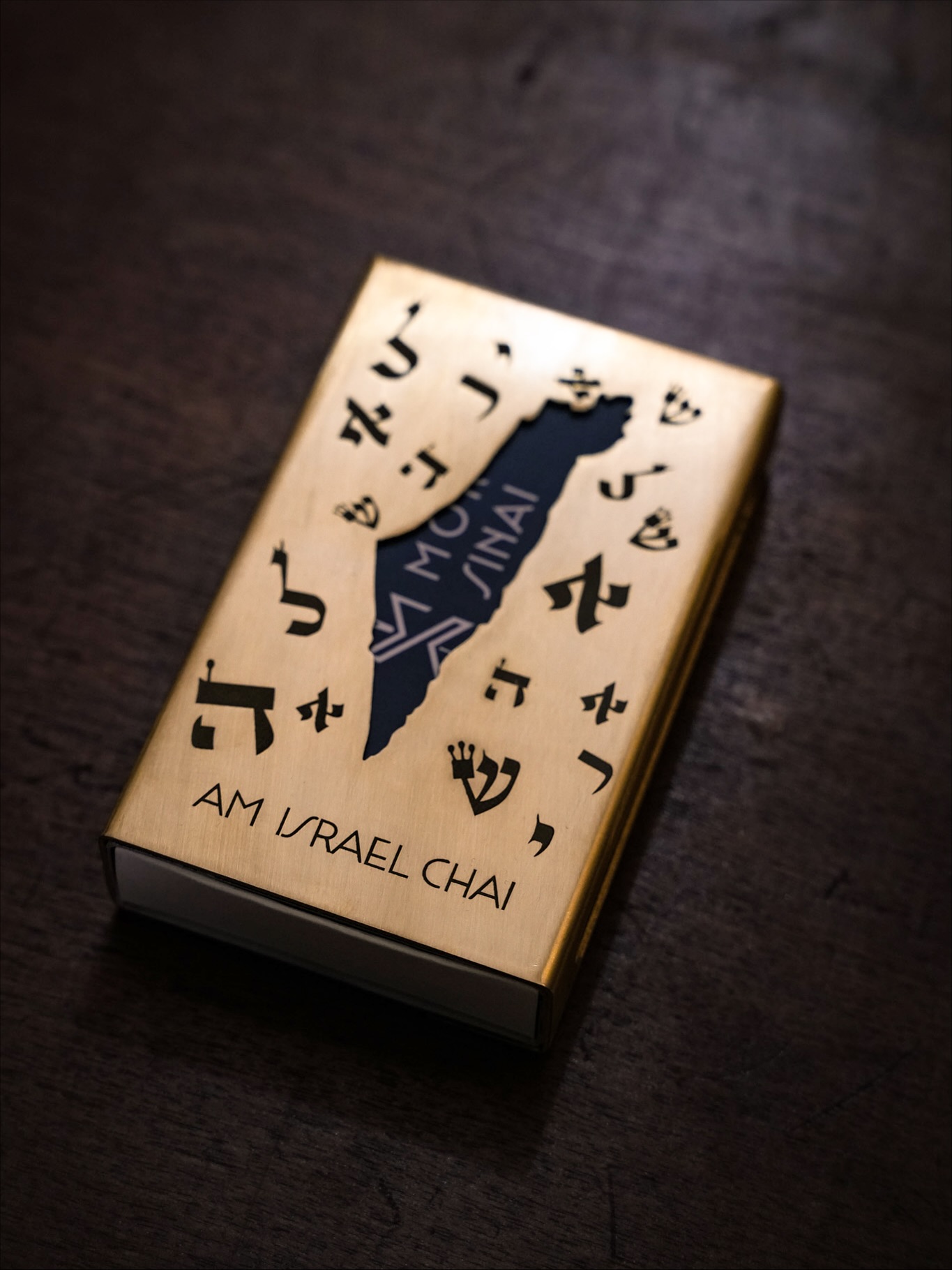 Introducing our new Brass Matchbox Holder - handcrafted in Israel, designed to elevate your Shabbat and holiday rituals.
Made from solid brass with refined Hebrew detailing, each piece is built to last a lifetime - a small object with real presence.
Size: approx. 4.3” × 2.6” × 0.8”
A timeless, meaningful gift for Shabbat dinners, Hanukkah lighting, or anyone who appreciates craftsmanship and heritage.