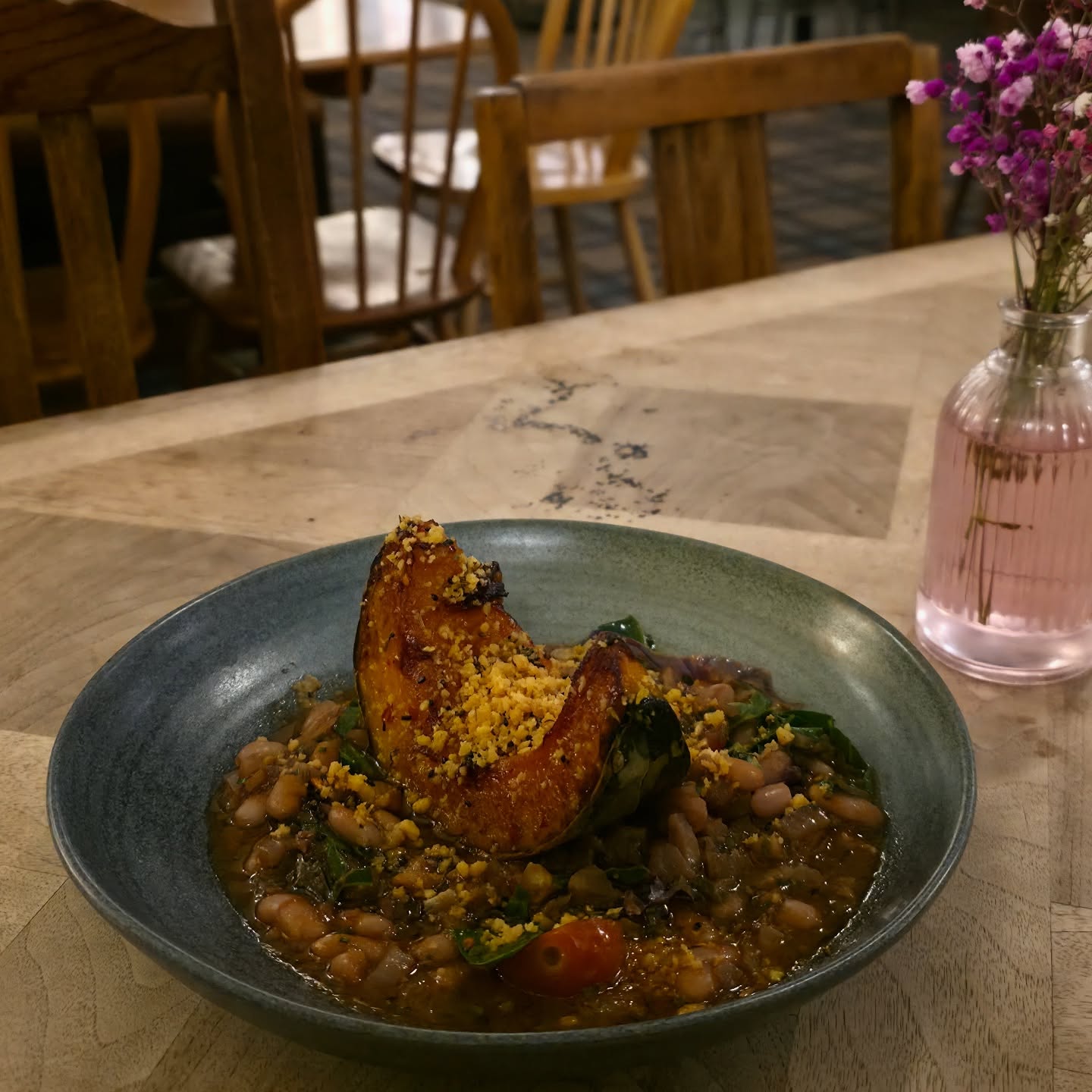 The perfect dish for these colder months: Maple Roast Crown Prince Squash with a cannellini bean ragu, heritage kale and pangritata 🍂