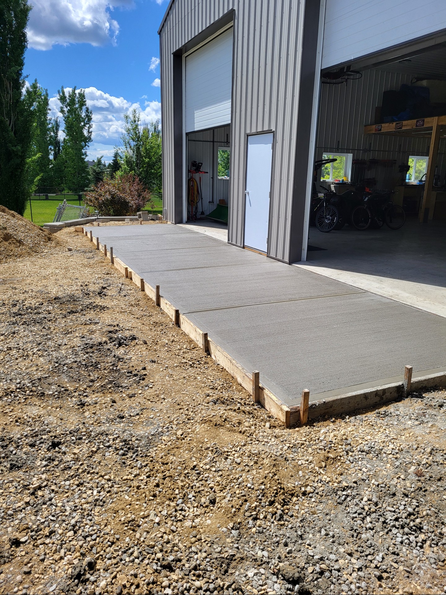 A solid pour for a solid shop — new concrete apron complete and ready for action. 🏗️ #LimitlessStructures #ConcreteWork #ConstructionLife #BuildLocal #DreamBuild