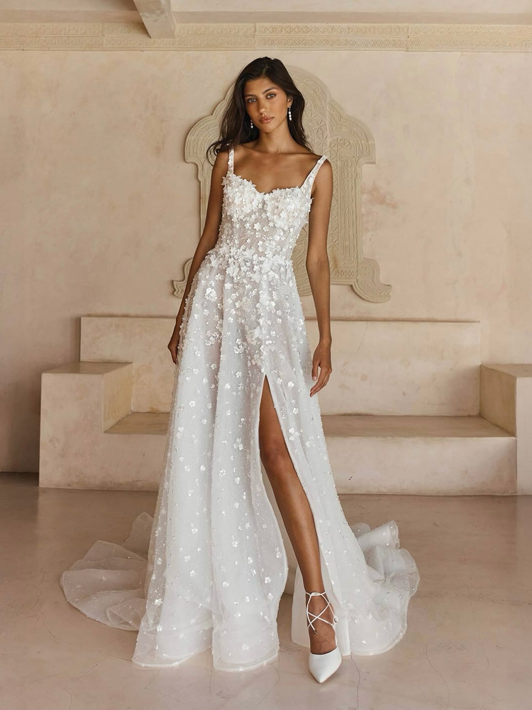 With the prettiest florals and a subtle sparkle, Leisel is a real show-stopper for our Madi brides who love a touch of glam.
She’s crafted with layers of intricate detail on a beautifully clean silhouette, modernised with the most stunning lace and flattering lines.
Her sweetheart neckline has been refreshed with a contemporary twist, supported by delicate shoulder straps that frame the décolletage and flow into a dreamy deep scoop back.
From top to toe, Leisel is adorned with sequin-beaded sheet lace and 3D floral motifs - tiny, delicate blooms that shimmer softly and suit any wedding style. The placement of the motifs around the bust and waist has been designed to elongate the body and flatter from every angle.
We adore the soft A-line skirt - lighter than a full ballgown but still beautifully floaty - with lace that gradually softens towards the hem. A feminine left-leg split adds movement and ease (and can be removed if you’d prefer no split).
A perfect row of buttons trails from the low back all the way through the illusion skirt to the airy, lightweight train, giving that magical “floating on air” finish.
Leisel is truly one of a kind and a standout within the Madi Lane collection.
#madilane #princess #alineweddingdress #glam #glamweddingdress #floralweddingdress #embellishedweddingdress #weddingdressdreams #bridalshopcumbria